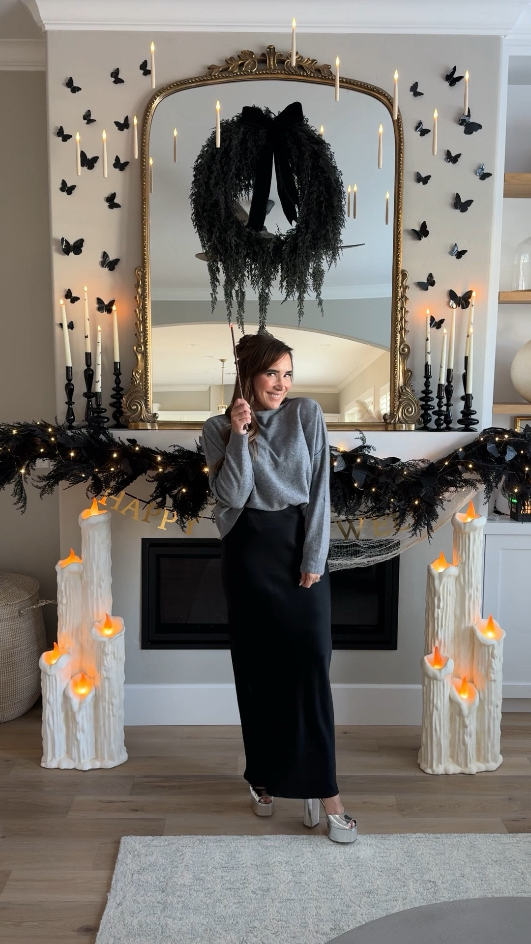 Halloween mantel reveal 🖤🦇🕷️ this years mantel is classic and whimsical! The black wreath is my absolute favorite, currently sold out but linked a similar one that’s is equally gorgeous! My garland is 4 years old from Crate and Barrel and my large floor candles are from HomeGoods 🖤 🕯️ 

#LTKHalloween #LTKVideo #LTKSeasonal