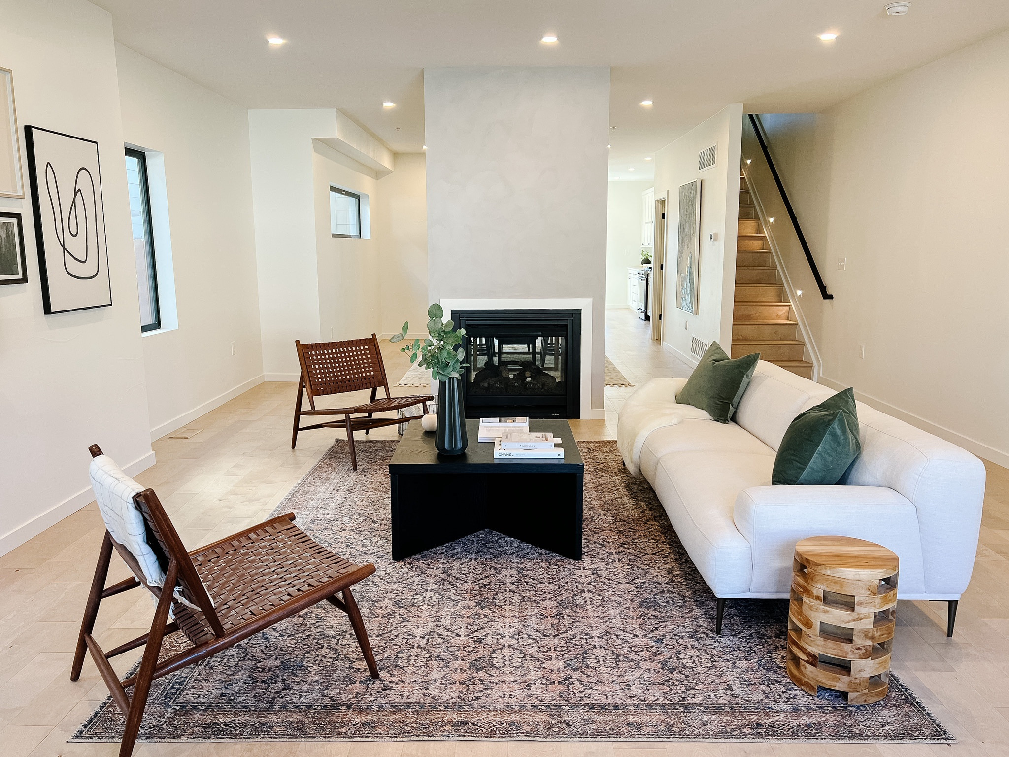You can never go wrong with an amazing rug! This one really adds some warmth to this modern living room we staged. 

#LTKHome #LTKU #LTKSaleAlert