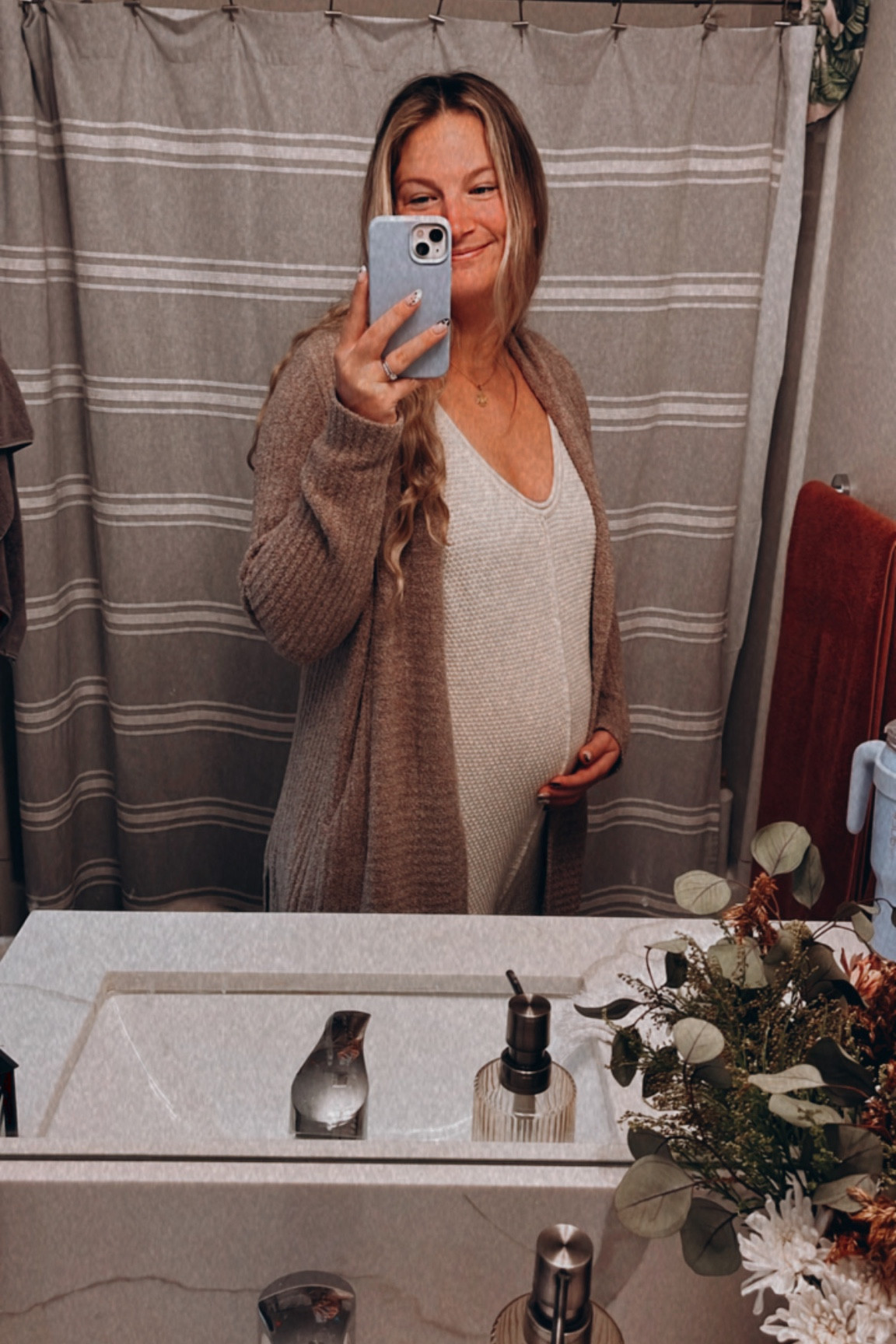 I LIVED in this Free People onesie throughout my pregnancy. So comfy for any time of year. I ordered my usual size and it fit my bump just fine because of the oversized fit and drop crotch. 

#LTKcurves #LTKbaby #LTKbump