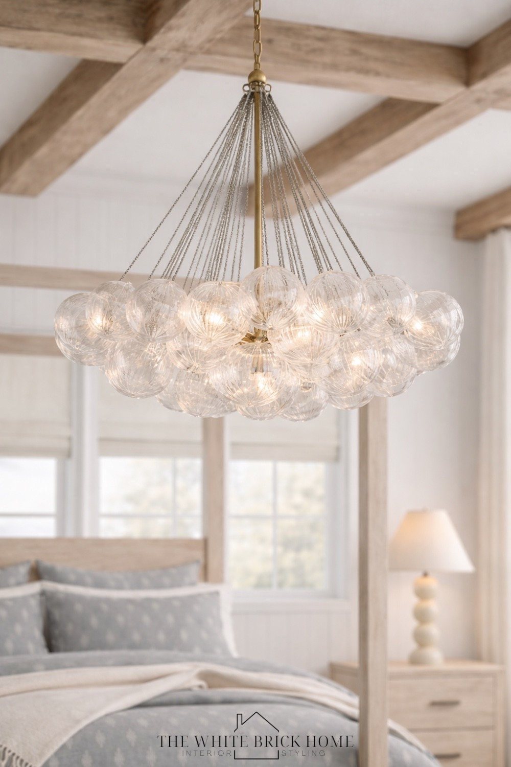 A cloud of glowing glass bubbles adds the perfect touch of modern elegance above this serene bedroom retreat. 
🖤🖤
Bed, bedroom, bedroom lighting, bedroom chandelier, bubble light, coastal bedroom, coastal room, table lamp, bedside lamp, canopy bed, bedroom design, bedroom decor ideas, home decor, neutral bedroom, pottery barn bedroom, coastal decor, coastal room, bedroom design, pottery barn 


#LTKSeasonal #LTKSaleAlert #LTKHome