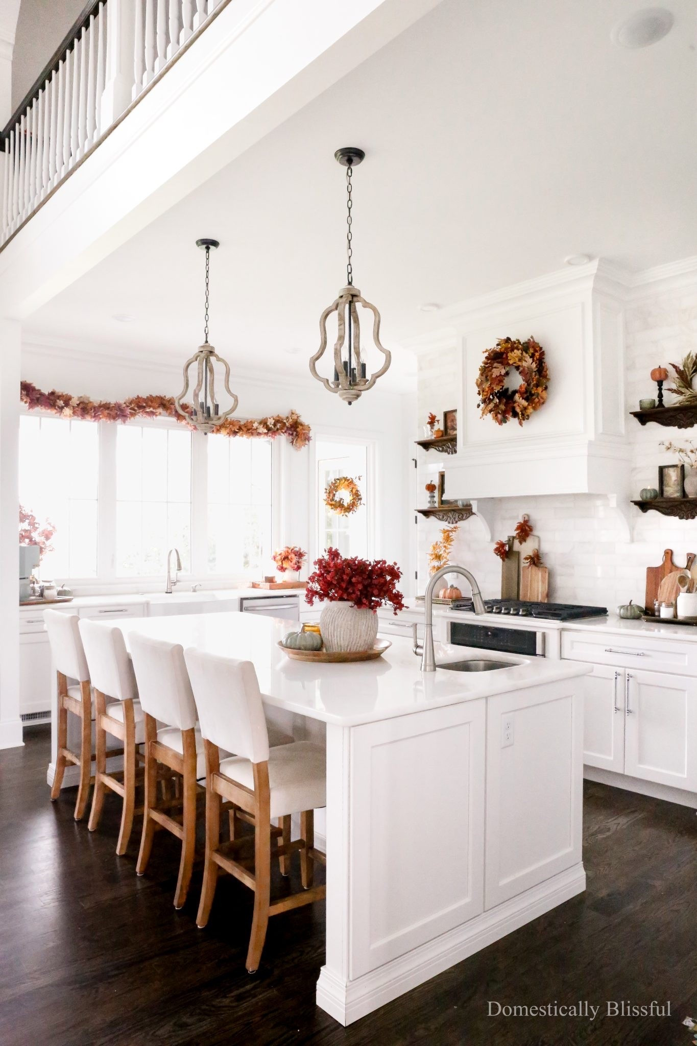 Simple Fall Kitchen Decor with moody fall colors, artificial leaves, garlands, wreaths, and autumn art in an all-white kitchen.

See details:
https://domesticallyblissful.com/fall-kitchen-decor-2026/

#LTKSeasonal #LTKHome