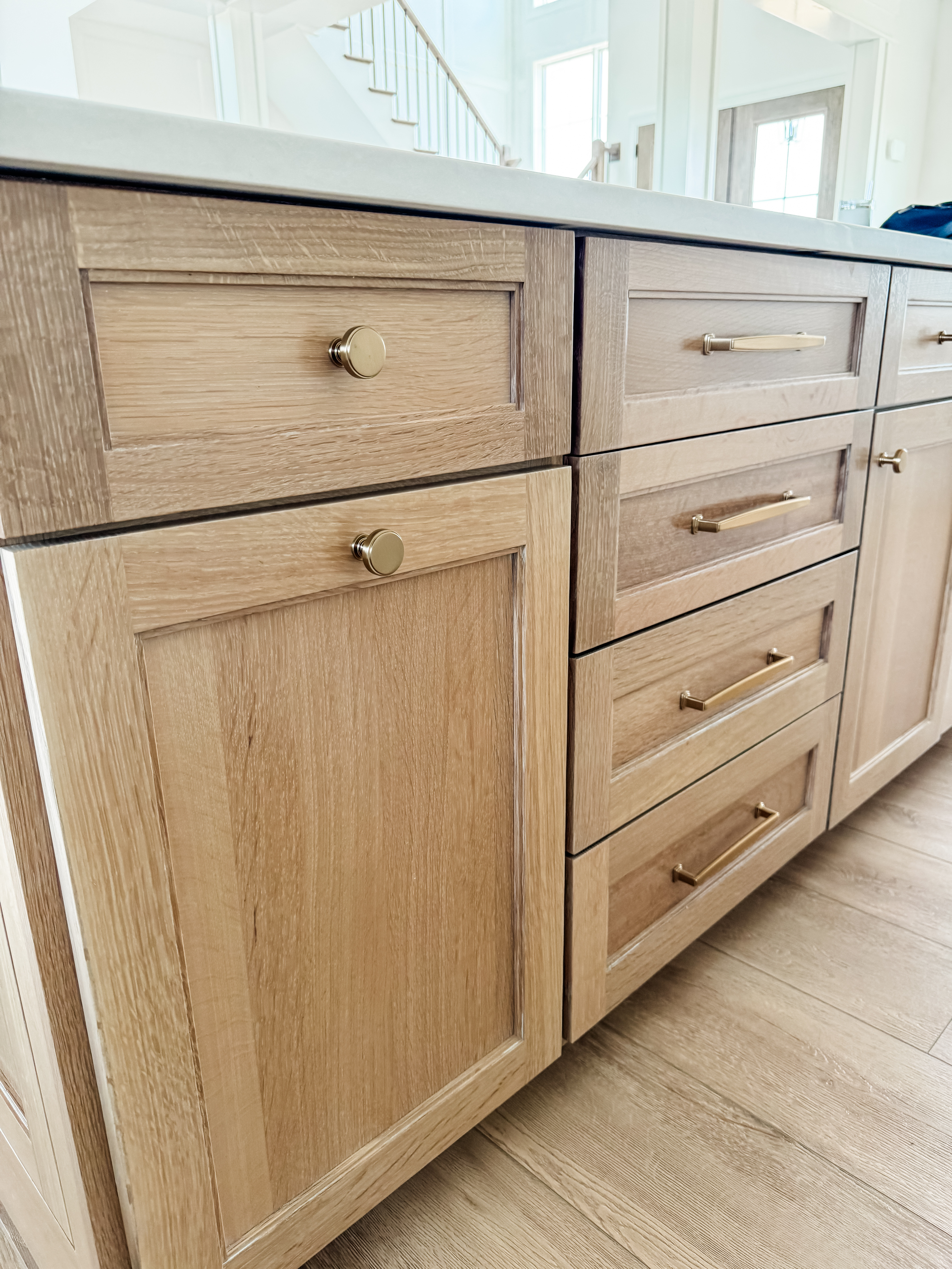 These sleek, modern knobs and pulls are a favorite on our kitchen cabinets. The warm brass finish complements the natural wood tones beautifully, creating a look that's both timeless and stylish. Mix and match knobs and pulls for a more designer look  

#LTKFindsUnder50 #LTKHome