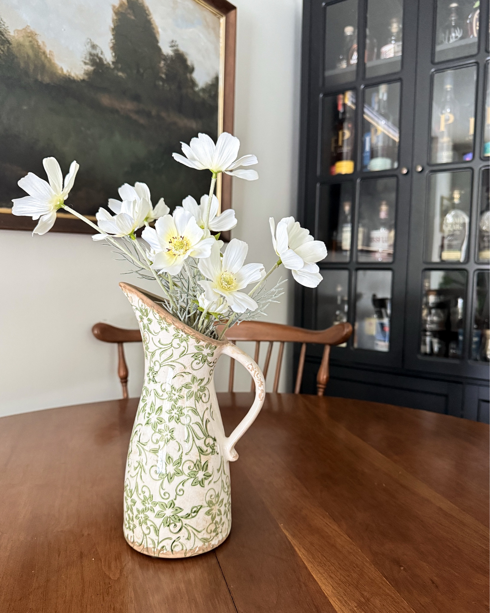 Craving some spring vibes and home updates 🌼
I found this green vase on Amazon and it’s honestly so nice. Heavy and has a beautiful unfinished look that’s great for a cottage-esque, vintage summer home vibes. 
The faux floral is also from Amazon and not great. I give it a C. Cheap, give the “look” from far away but that’s about it. Would not repurchased and was $10 so didn’t seem worth the trouble to return 
Painting was a DIY so I linked some with a similar look! 

#LTKStyleTip #LTKFindsUnder50 #LTKHome