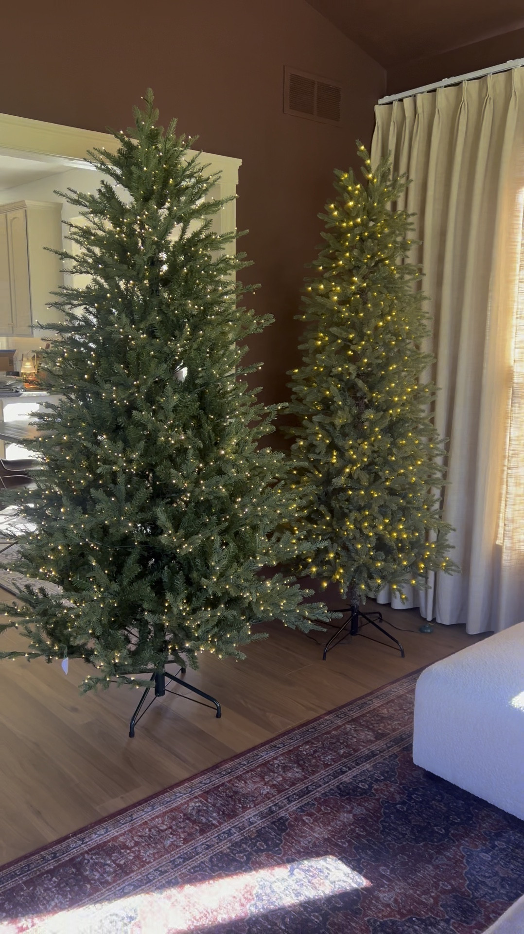 The viral tree on the left (full size) compared to the slim on the right ! Both very pretty. 

The left is a little less uniform shape , which I love and the lights are a little smaller. 

But the slim is very realistic looking and less expensive. 

Both are a 10/10 for me!!

#LTKSeasonal #LTKHome #LTKHoliday
