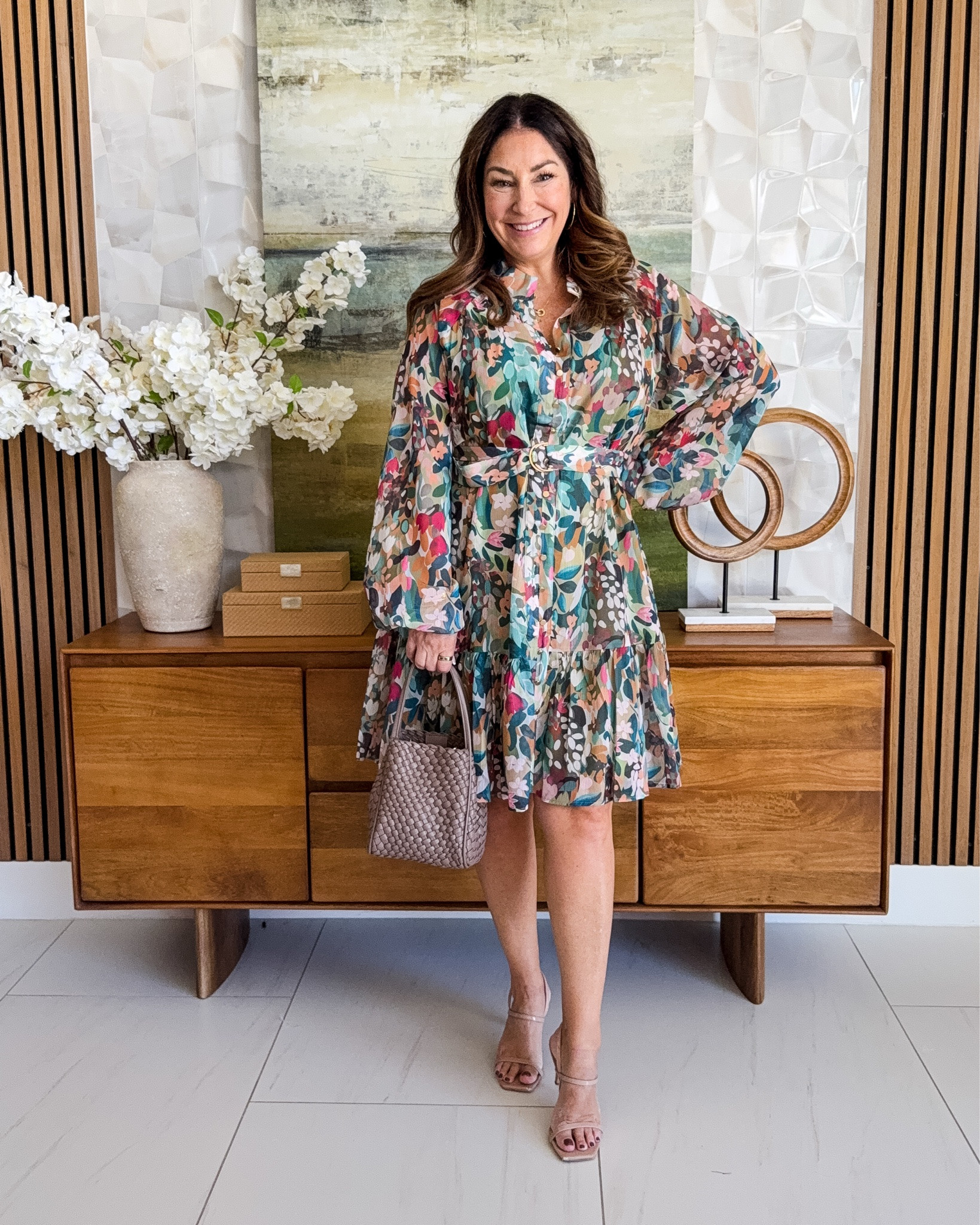 The prettiest floral dress 🌸 Multicolor abstract floral print mini dress with sheer balloon sleeves and a belted waist, styled with a taupe woven bag and nude strappy heels. A colorful wedding guest and date-night dress that transitions summer to fall.

Sizing: true to size, large

#LTKOver40