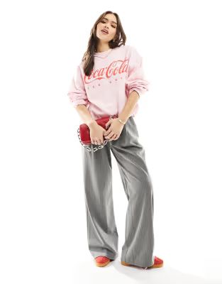 ASOS DESIGN oversized sweat with coca cola licence graphic in pink | ASOS (Global)