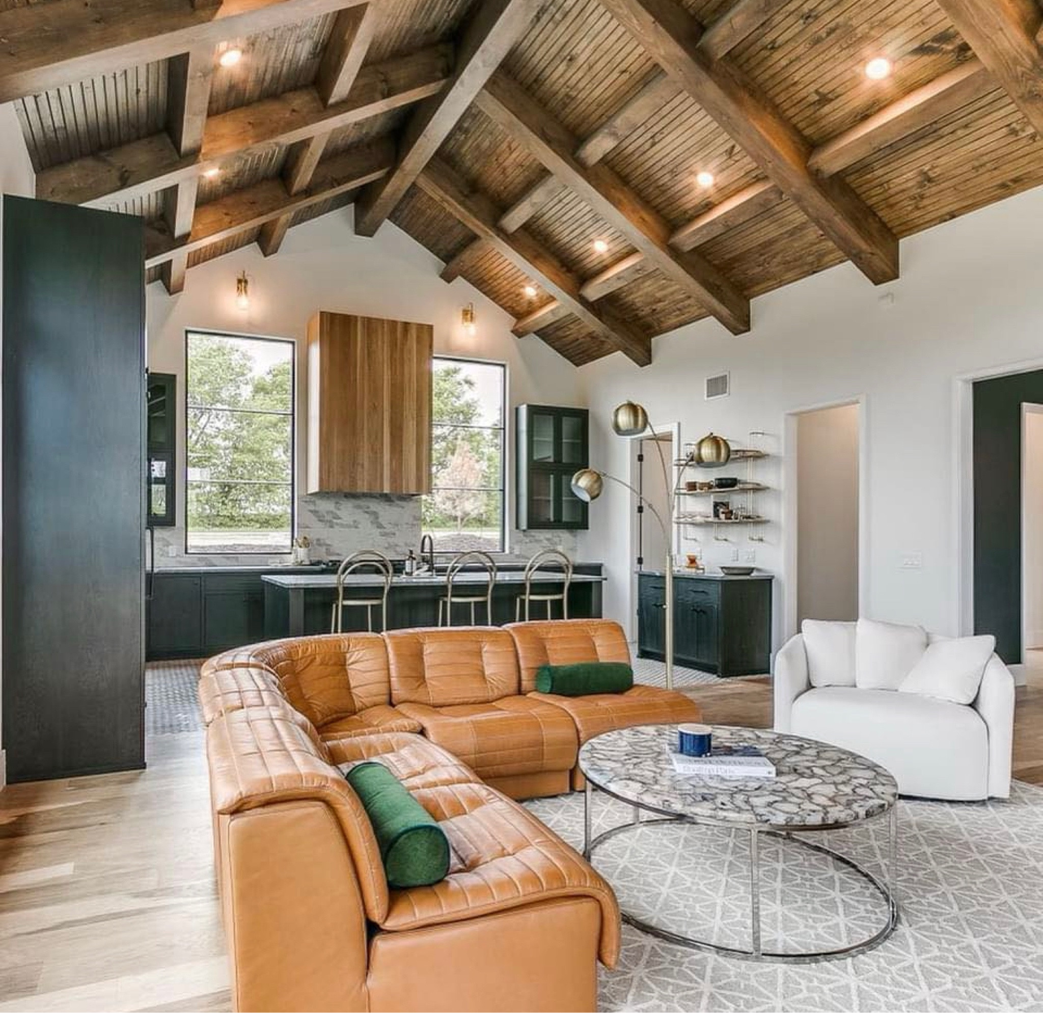 Our mid-century modern farmhouse is a stunner.  The open kitchen design with leather, wood and windows is light but moody.  *Sofa can be ordered.  

#LTKhome #LTKstyletip