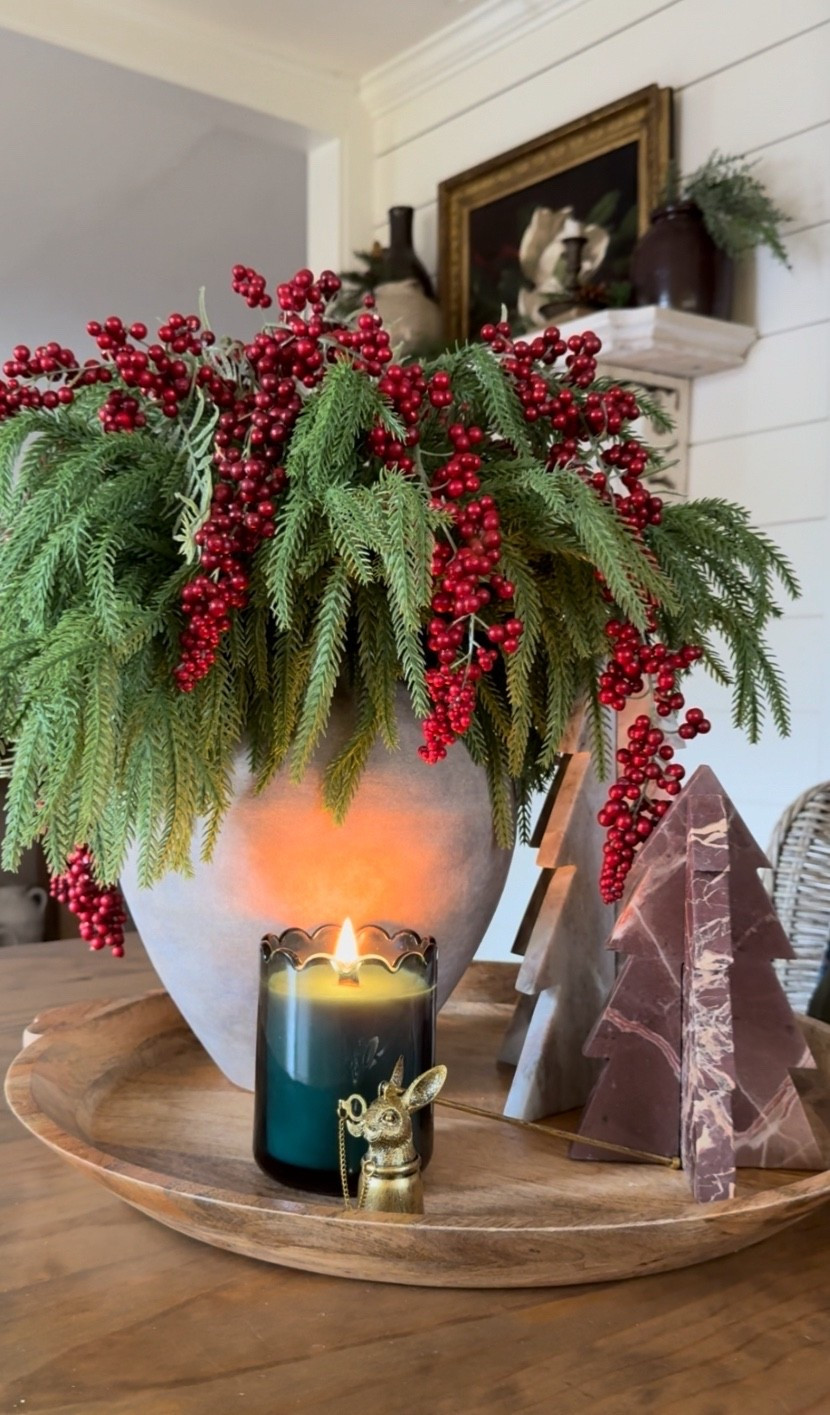 ✨ How to Build a Christmas Centerpiece That Feels Collected, Old-World, and Effortlessly Designer ✨
If you’re craving a Christmas centerpiece that looks high-end without the stress, here’s my favorite formula—easy, flexible, and absolutely stunning every time. Start with any tray as your base, then anchor the look with a piece of old-world inspired designer pottery—the kind with a beautiful aged patina that brings instant character and charm.
Next, build your foundation using greenery stems. Faux or fresh works—just make sure it spills naturally over the rim to create that lush, timeless Christmas feel. From here, you have options:
• Add red or white berries for a classic holiday pop
• Use magnolia stems for an elegant Southern touch
• Or tuck in red roses for a romantic, moody Christmas moment
Sometimes I love to finish the vase with a simple bow for extra charm. Then, decorate the tray with a few accent pieces—candles, bells with bows, marble trees, a deer statue, or anything beautiful you already have at home.
Here’s the design rule that makes it foolproof:
⭐️ Use odd numbers.
The vase + arrangement counts as one item. A cluster of three bells counts as another. A single candle in front could be your third. Our eyes are naturally drawn to groups of three, and that’s why this layout always feels balanced and intentional.
This simple method works for any Christmas centerpiece—mix and match pieces you love, play with scale and texture, and let your personality show. That’s what turns decor into something magical. ✨🎄
#ChristmasCenterpiece #HolidayDecorIdeas #OldWorldChristmas #DesignerHolidayDecor #ChristmasStylingTips #HomeDecorInspo

#LTKHome #LTKstorytime #LTKHoliday