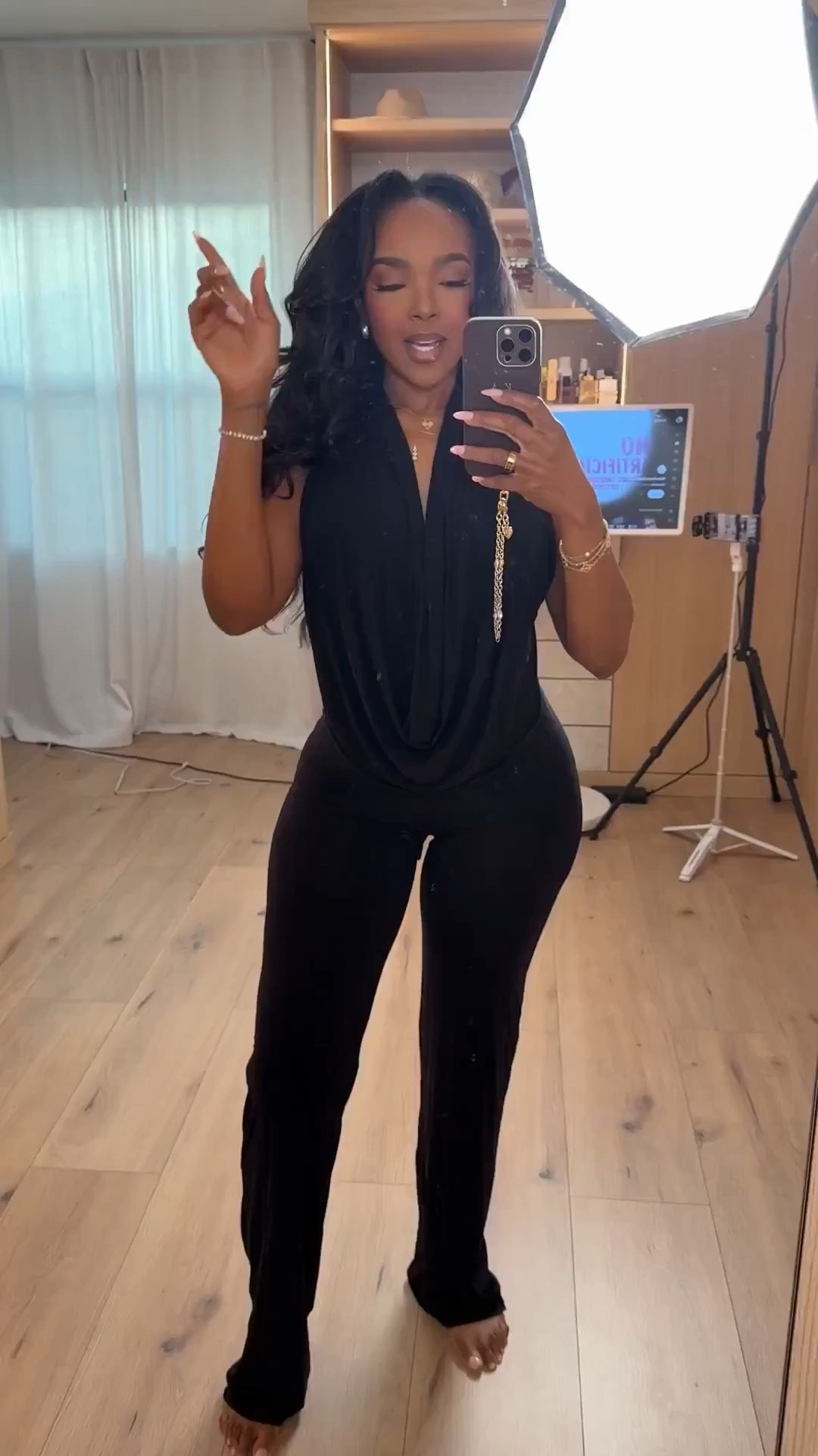 Scroll to shop!! This all-black outfit featuring a draped sleeveless top paired with flattering fitted pants is perfect for dinner dates, nights out, travel outfits, or an elevated everyday look.


