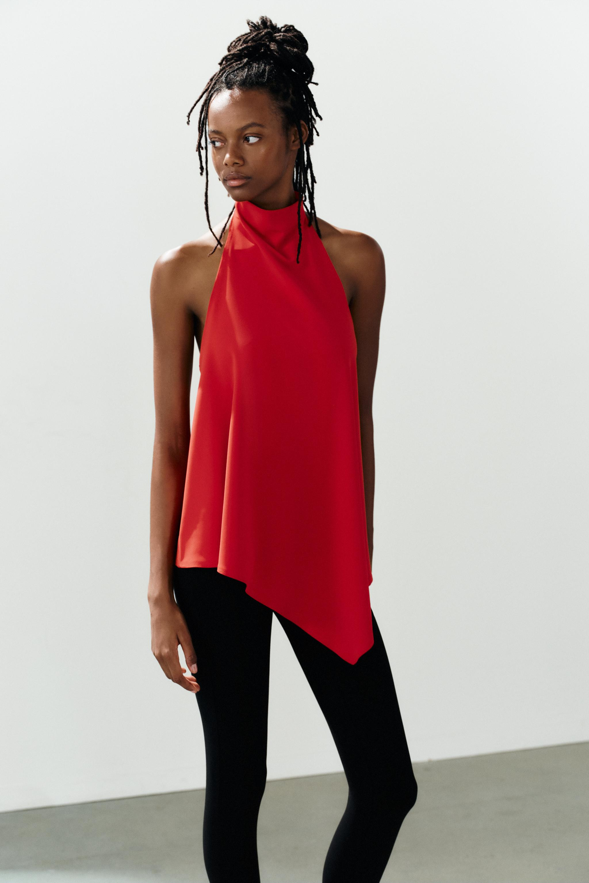 Top crafted from stretch fabric. Features a halter neckline and an asymmetric hem. Button closure... | Zara US