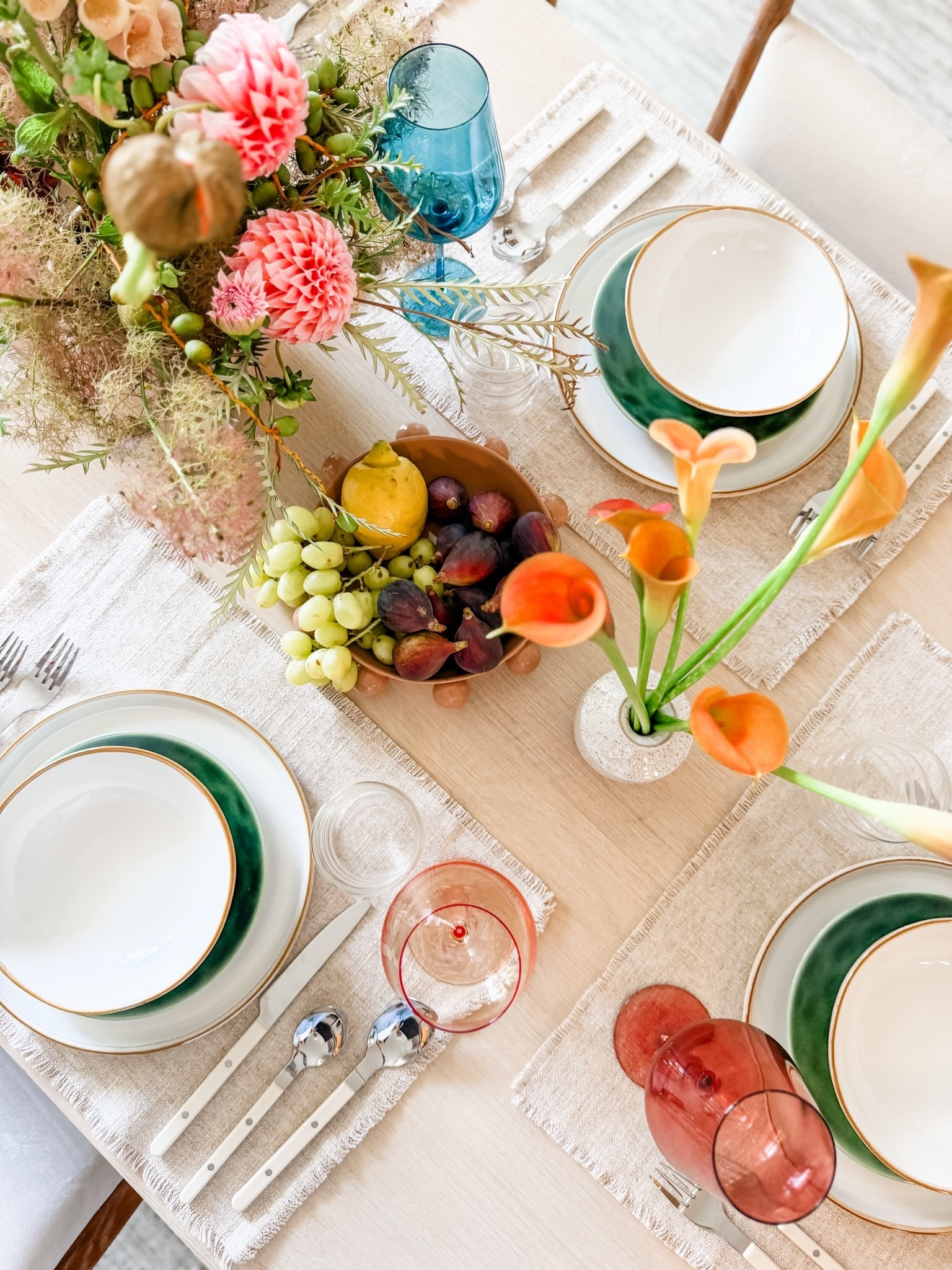 Everything on this table is Amazon 🍋 The colored glasses, the flatware, the taper candle holders, the acrylic ruffle bowl, and the rattan paper runner you just tear off and toss when dinner is over. Easiest hosting setup I have found.

#summerhosting #tablescape #founditonamazon

#LTKfoodie #LTKHome #LTKSeasonal