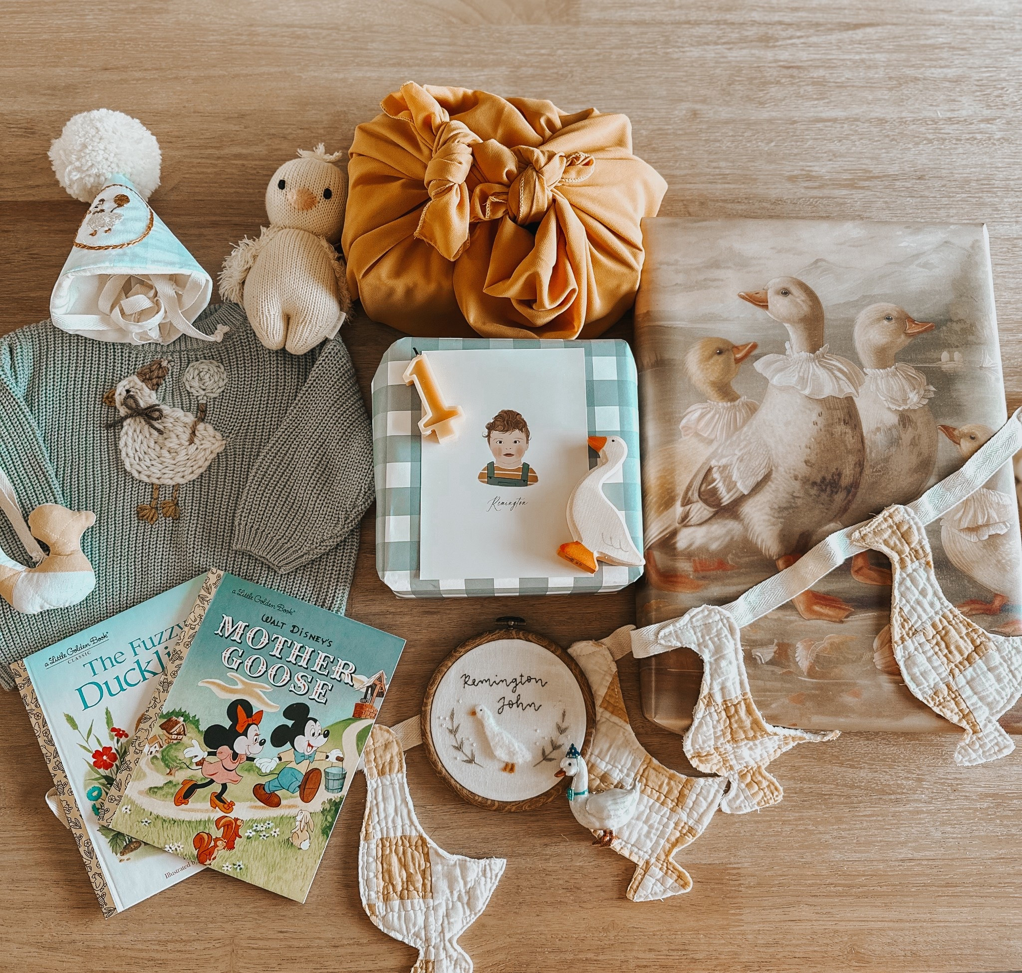 gift wrapping details for my silly goose🪿love doing these gift flatlays with fun goodies! 
-sweater: @wyldeaspyn (code occurringwitholivia) 
-silhouette: @ohhoneysilhouettes
-candle: @liamandthebees 
-quilted goose banner: @mothersmadeit
-embroidery hoop: @gladlyknotted

#LTKKids #LTKBaby #LTKParties