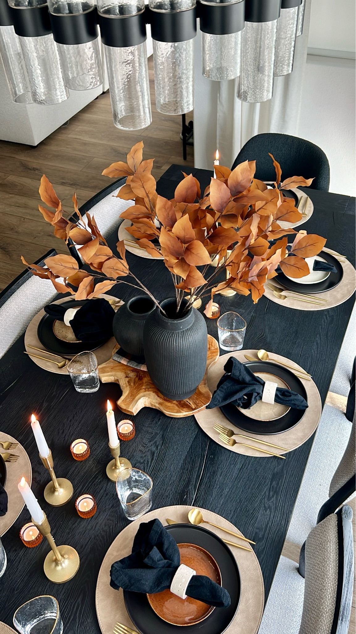 A dining table for fall! Fall tablescape, black dining table, round leather placemats, travertine napkin ring, fall vase decor, gold flatware, gold rimmed glasswaree

#LTKHome #LTKSeasonal