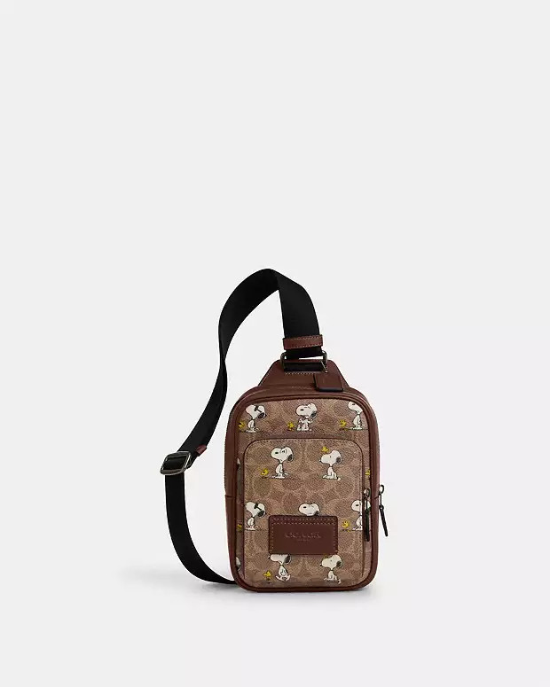 Coach X Peanuts Racer Sling Pack In Signature Canvas With Snoopy Print | Coach Outlet US