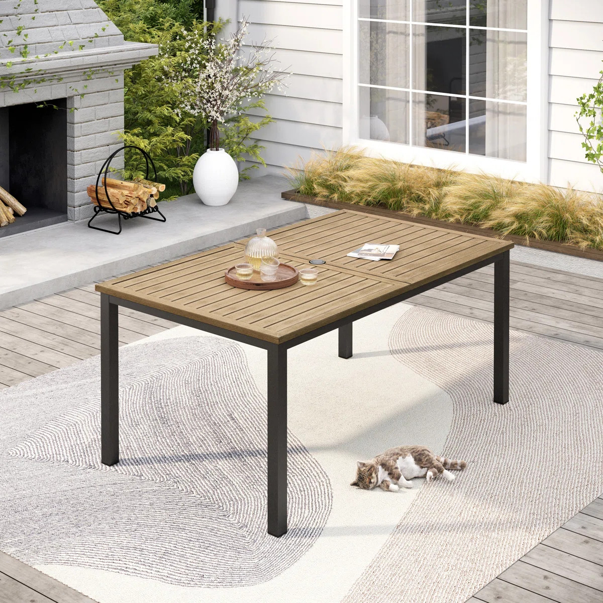 Aury 38" W x 64" D Rectangular Metal Patio Dining Table with Umbrella Hole | Wayfair North America