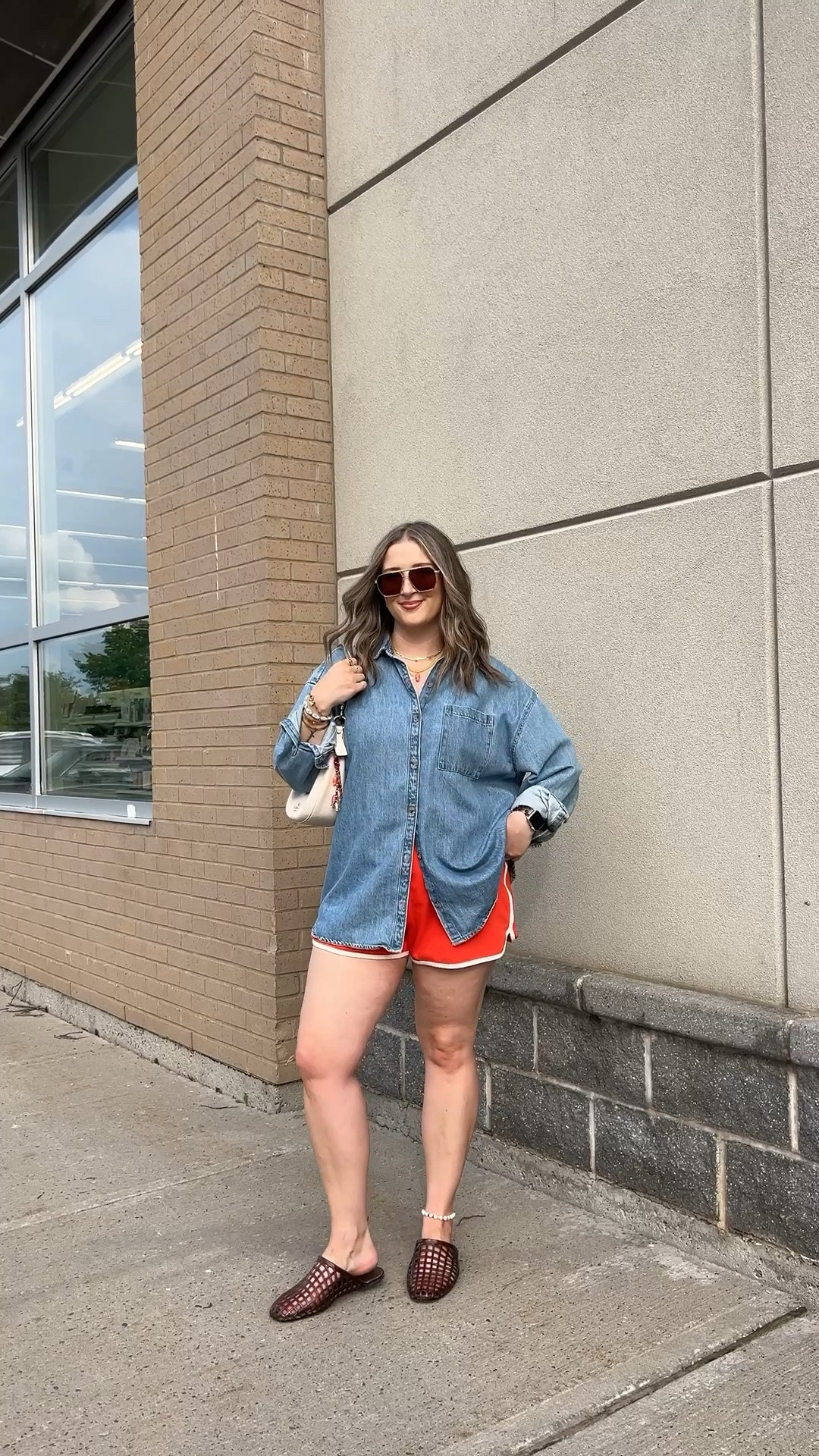 Casual summer outfit! Wearing my usual size L in the red orange dolphin shorts and my fave denim shirt. Jelly shoes are comfy and not sweaty, I’m a 9.5-10 and wear a 10. Canadian shirt and shoes link under “similar products”

#LTKsummer #LTKsale #LTKmidsize