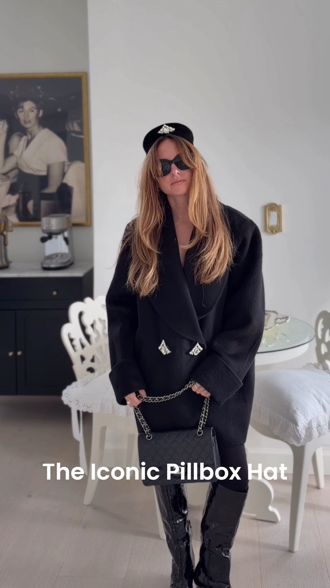 An all black look made super chic with the iconic pillbox hat.