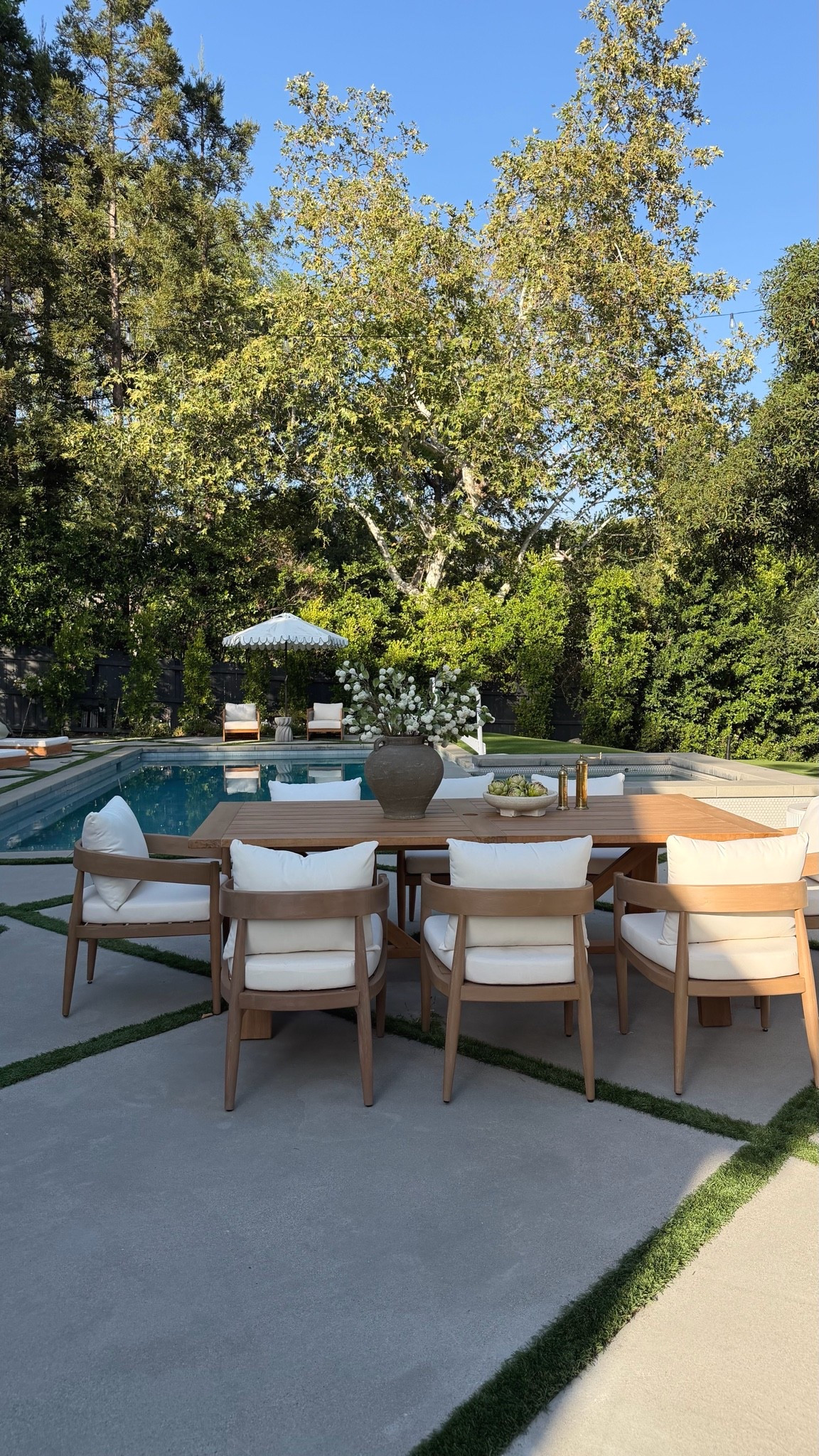 Love this dining set! The teak wood has such a pretty tone and I love the soft curves on the chairs! The chairs are made from tropical hardwood which naturally resists moisture, rot, and insect damage. Perfect addition to our backyard space!

#LTKHome #LTKSaleAlert