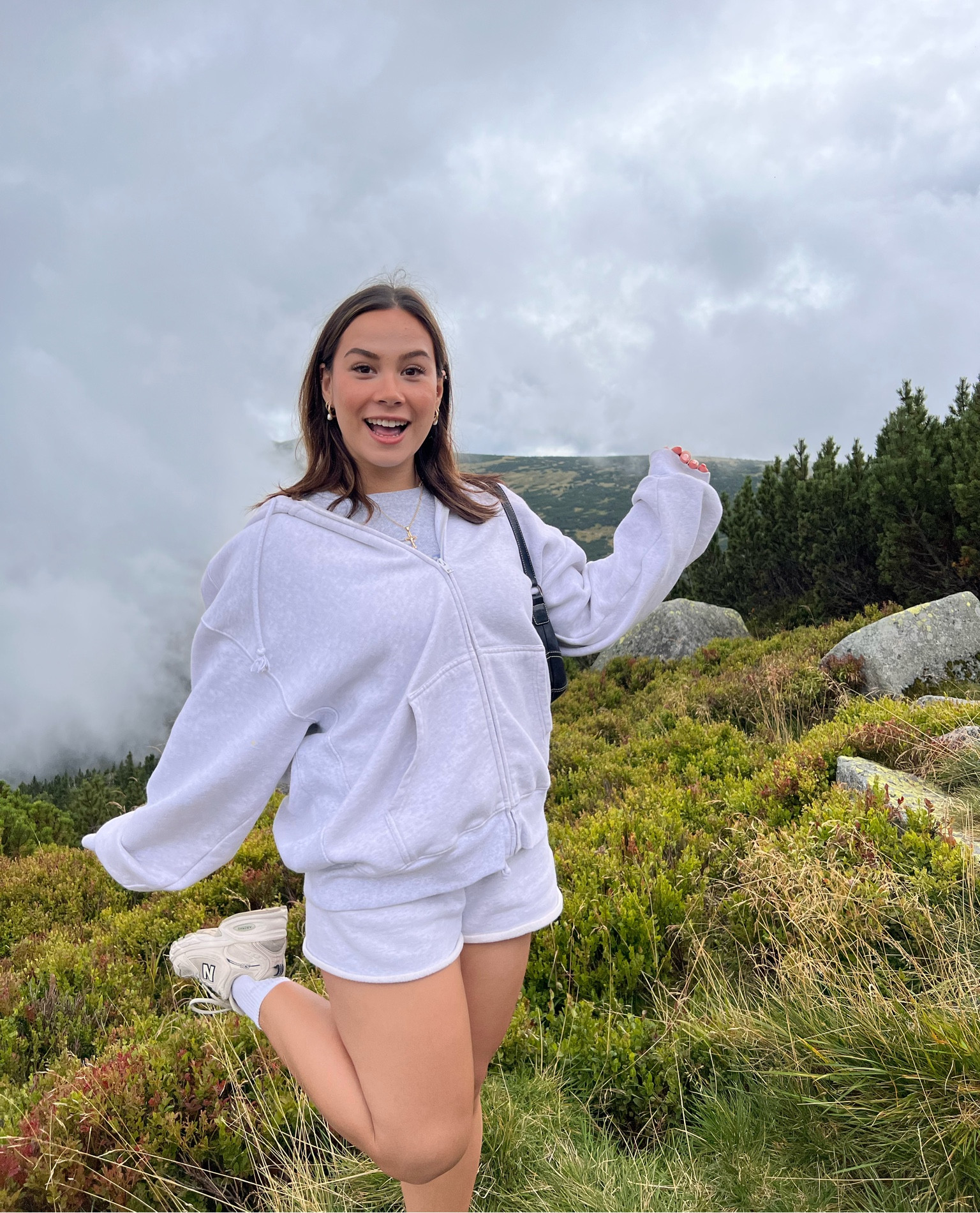 Cozy casual spring/fall outfit for going out or lounging at home in. Wearing a heather grey Sweat set from Aritzia, beige New Balance 530 running shoes, and a baby tee from Aerie. 

#LTKGiftGuide #LTKfindsunder100 #LTKHoliday
