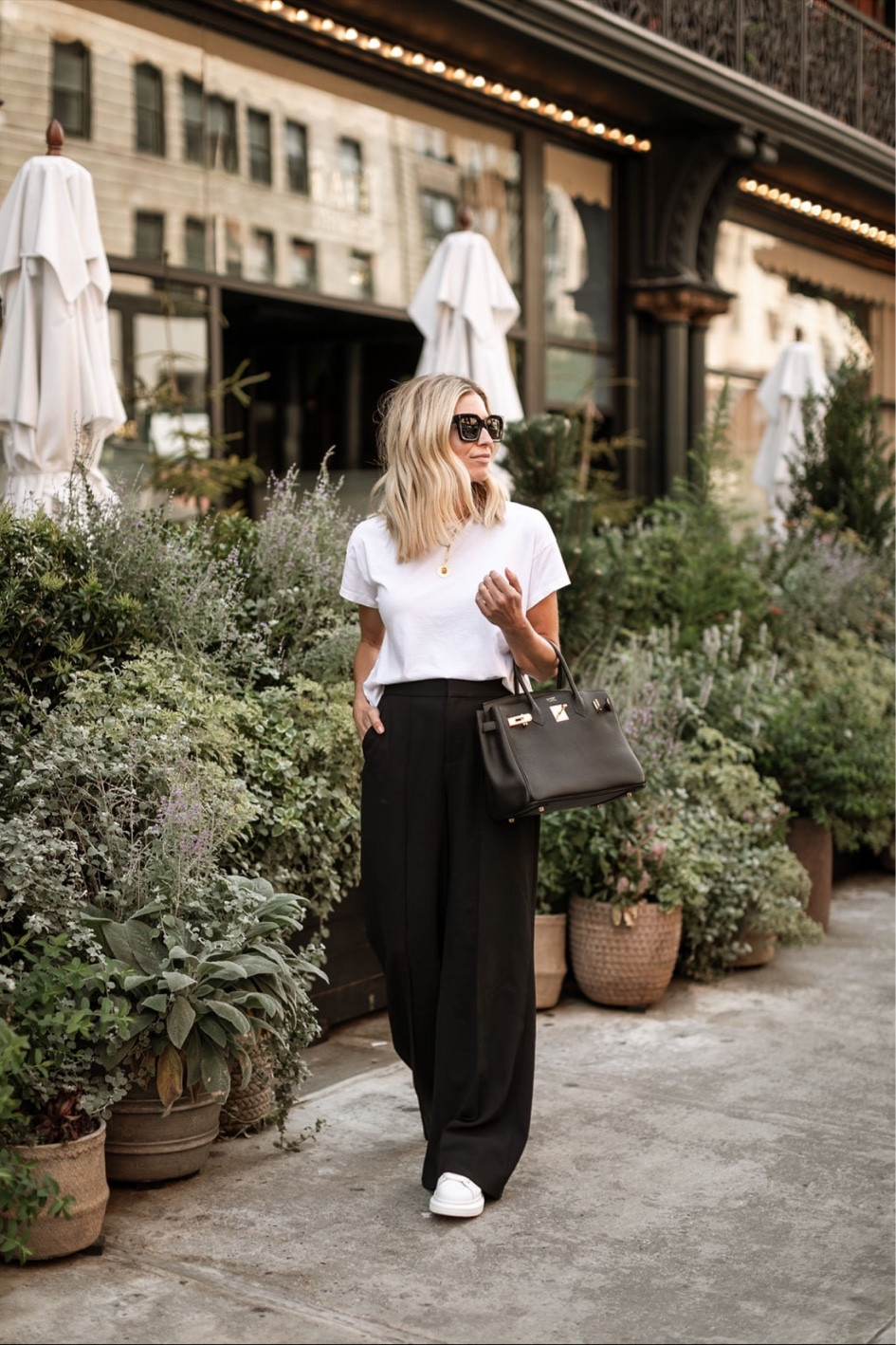 City inspired workwear 🖤 black wide leg trousers, white tee, black tote bag, white sneakers, black sunglasses and lariat necklace 

#LTKSeasonal #LTKworkwear #LTKstyletip