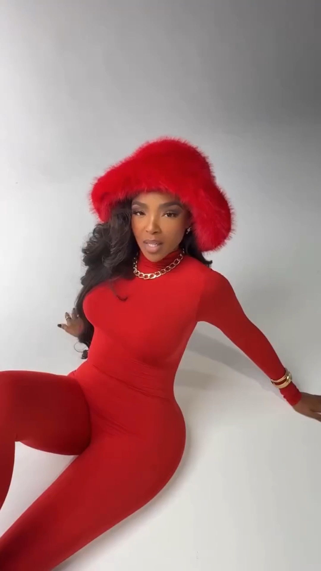Look expensive Moment ❤️ These bold looks is giving confidence, power, and full-on statement energy. The sleek, curve-hugging fit paired with the faux fur hat takes this look from simple to show-stopping. Gold jewelry adds the perfect finishing touch.  

Perfect for holiday parties, date nights, or any moment you want all eyes on you.  

📏 Sizing: Wearing size small | fits true to size with stretch  

Tap to get details and shop this statement jumpsuit that turns heads the second you walk in.  

Follow my Instagram @kirasfashionfinds on the @shop.LTK app to view this post and get my exclusive app-only content!  

red jumpsuit outfit, holiday party look, bold monochrome outfit, amazon fashion 2025, statement jumpsuit, winter glam style

