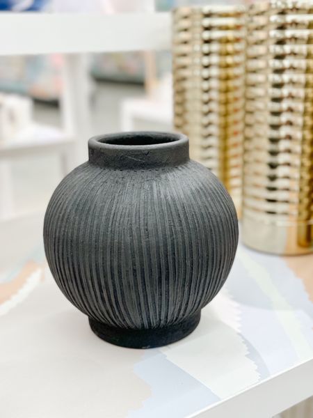This round black textured vase is the perfect decor accent to any modern or traditional home decor. It’s a beautiful accent piece to style your coffee or console table, sideboard or bookshelf and is also available in a taller version. living room decor accessories flower vase black decor modern decor neutral decor 

#LTKfindsunder50 #LTKhome #LTKstyletip