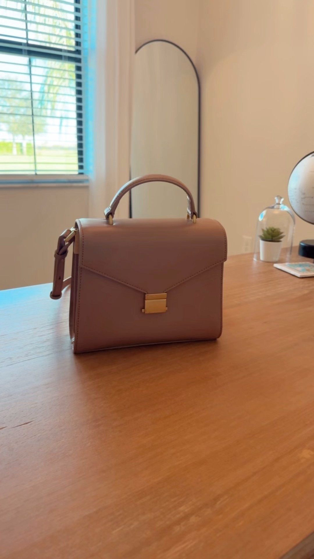 This beautiful Italian leather handbag with a top handle and adjustable crossbody strap is on sale! 