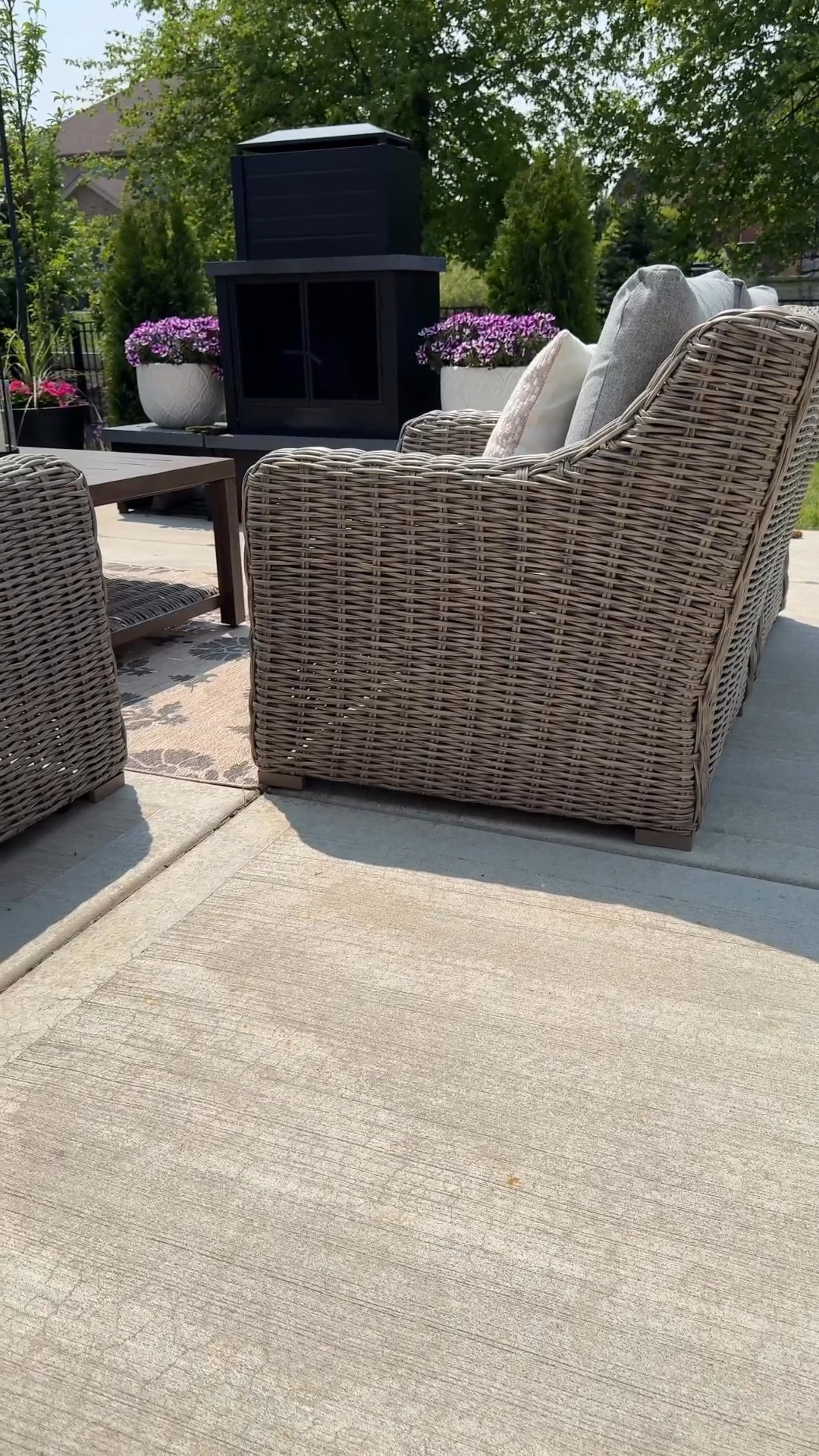 Wicker outdoor patio set, outdoor fireplace 

#LTKHome #LTKSeasonal