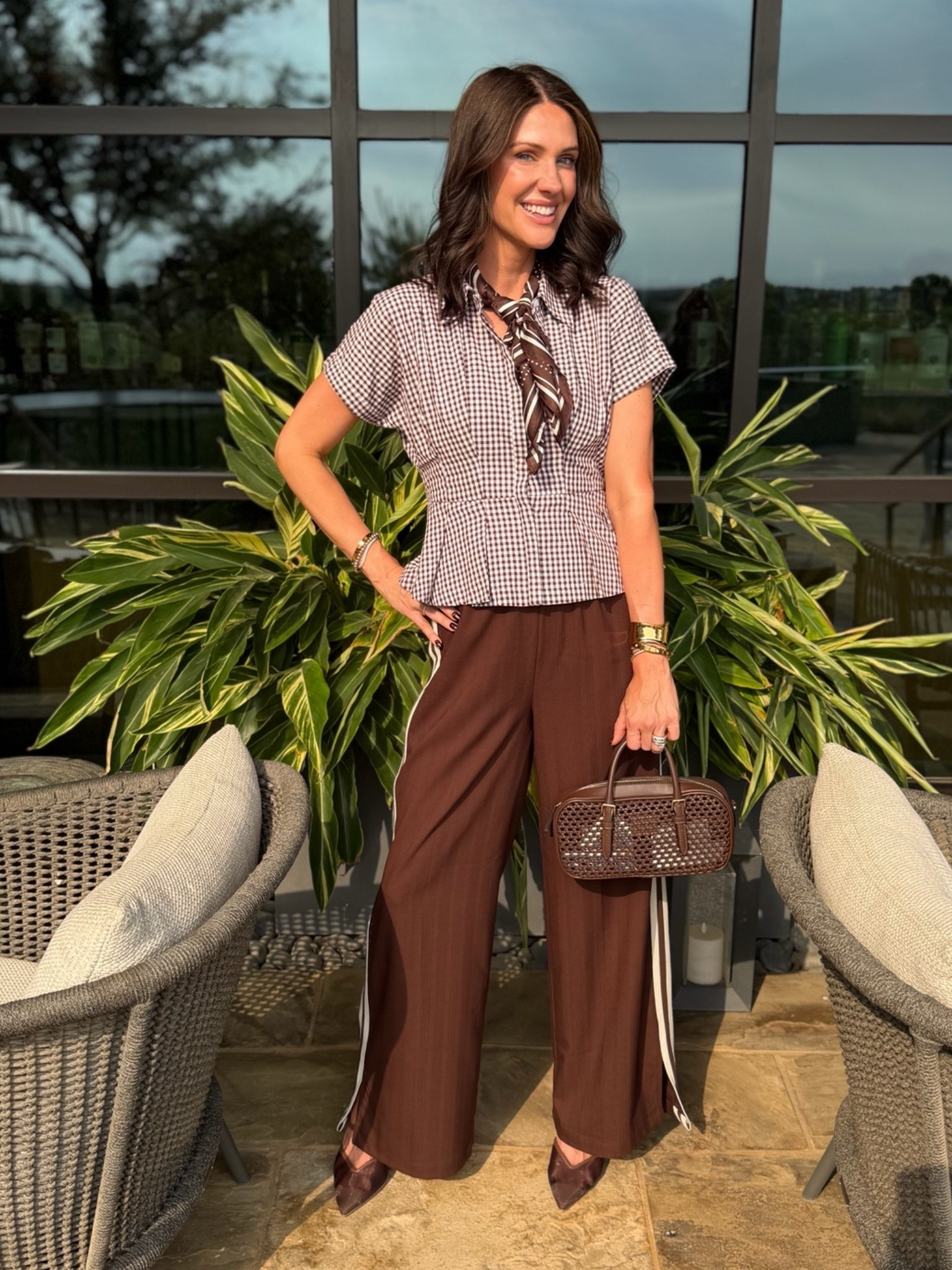 I love a good track pant with a button down and scarf. Wearing an XS in the pants (size down). There is a great little slit at the bottom hem. Wearing a small in the brown gingham top TTS. the bag is on clearance and has a long strap as well.

#LTKCon #LTKootd #LTKWorkwear