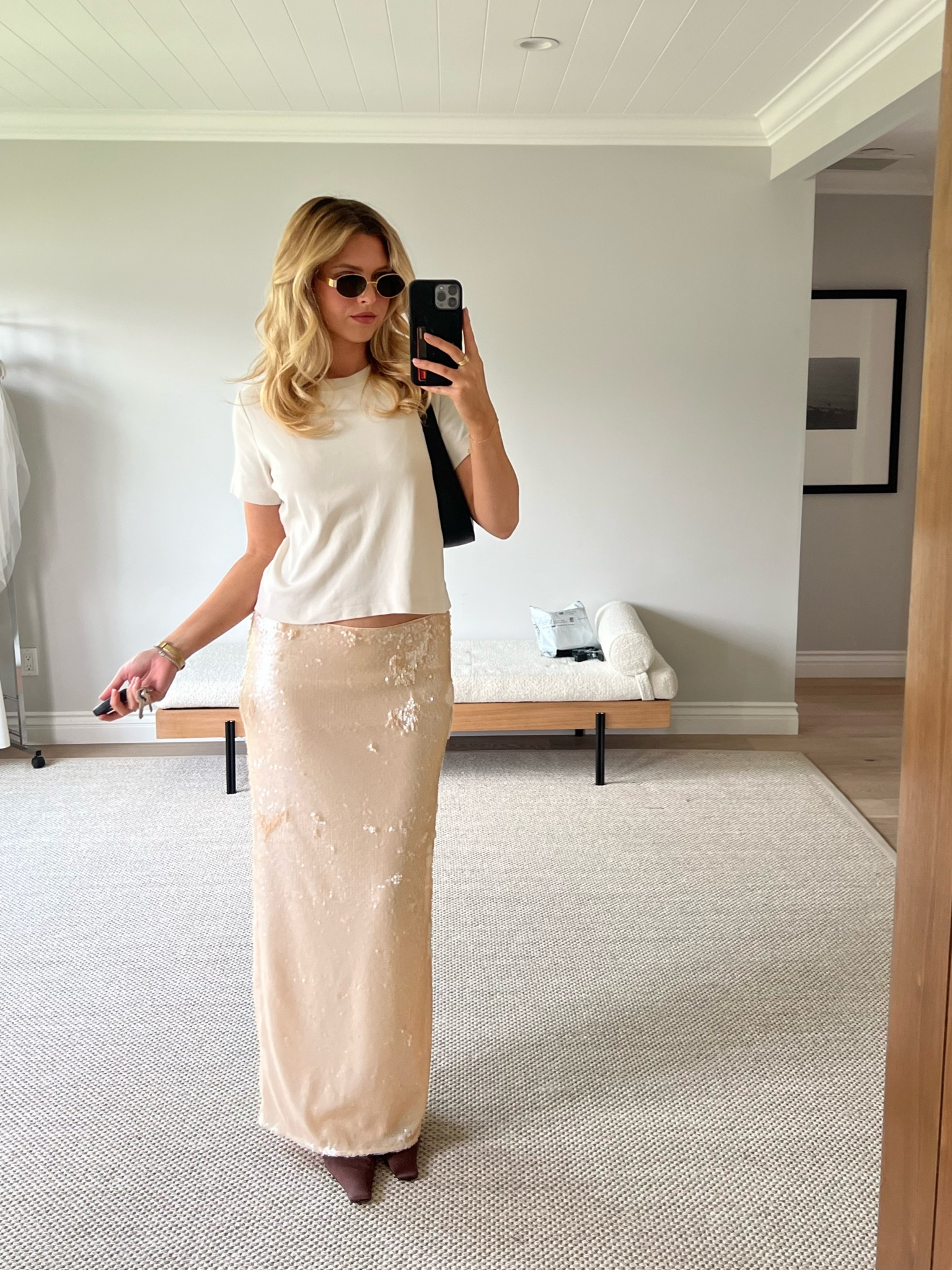 A fun summer look. The coolest sequin skirt from Revolve. Dress it down with a basic tee and kitten heels 