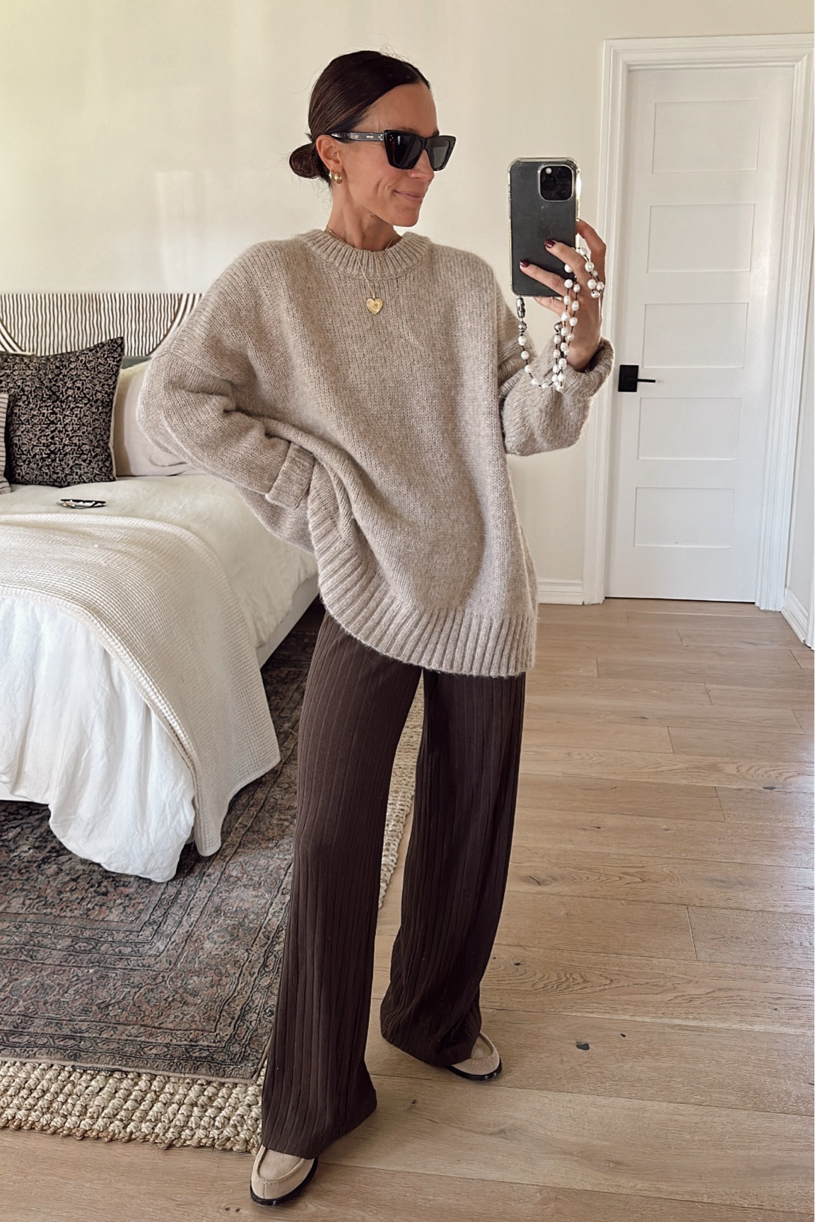 Casual thanksgiving outfit idea 
Sweater is a naturally oversized fit 
Brown knit pants are short gal friendly  (if you wear them high waisted. I am between 5’1 and 5’2 and they graze the floor) 

#LTKOver40