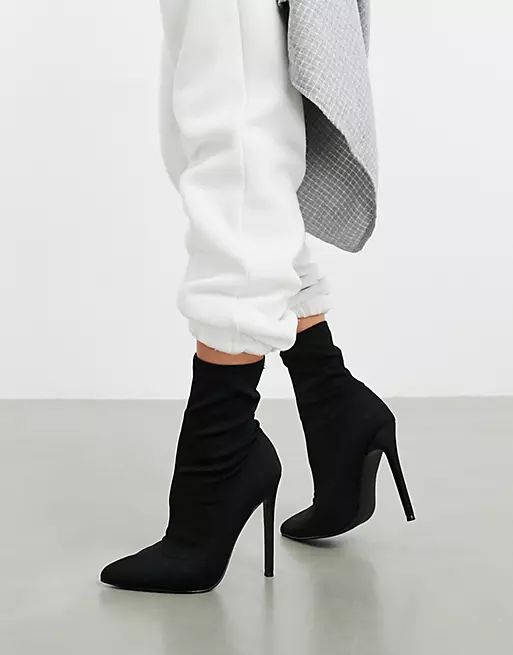 ASOS DESIGN Esmerelda high heeled sock boots in black | ASOS (Global)