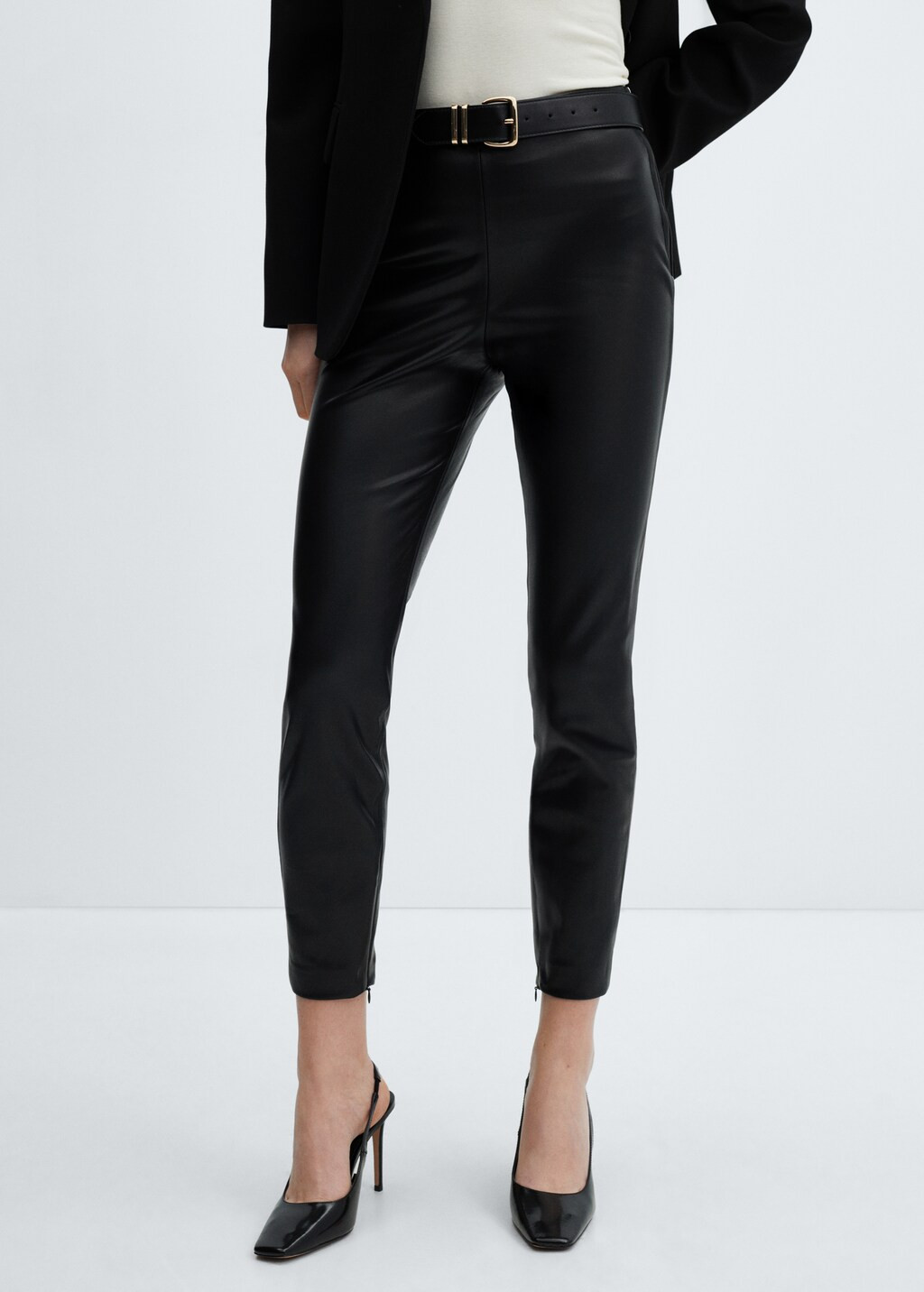Leather-effect leggings with split hems - Woman | MANGO United Kingdom | MANGO (UK)