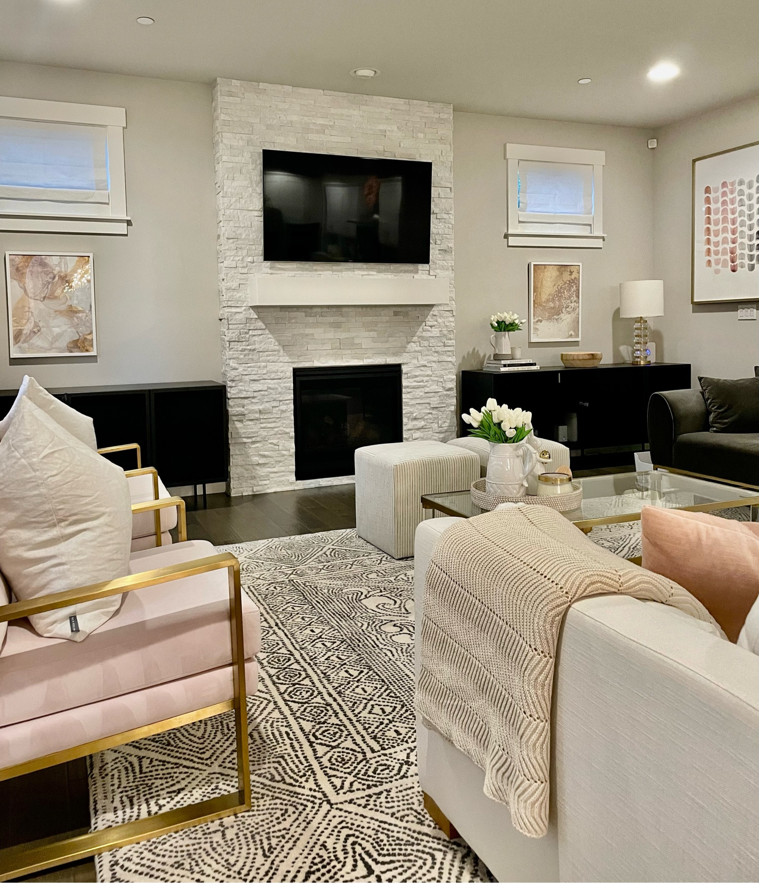White and black living room, CB2 living room console, acrylic gold coffee table, pink chairs, Minted artwork pink and gold, black and white rug

#LTKhome #LTKxAnthro