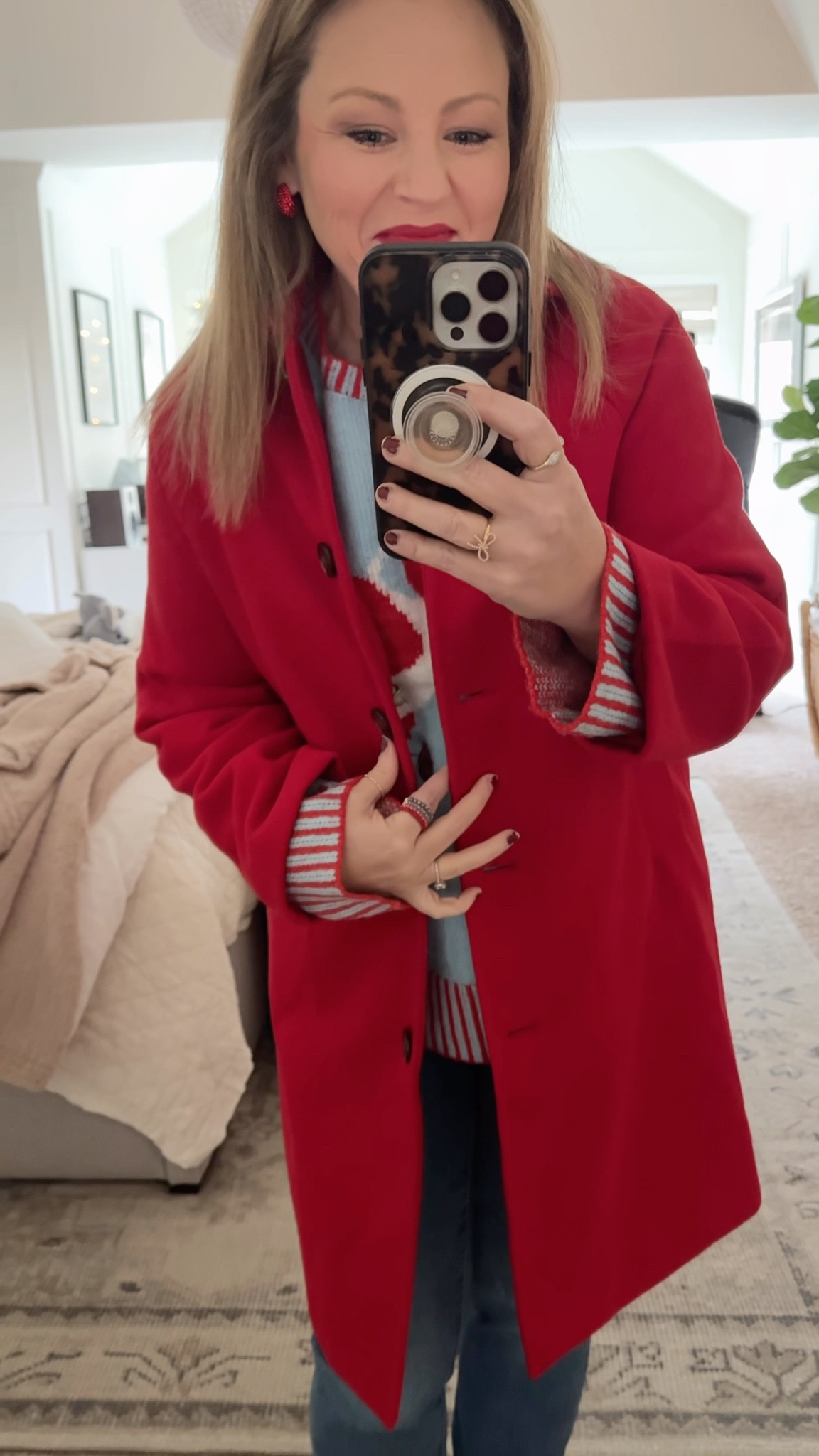 Not gonna lie, I don’t think I’ve ever felt cuter than I do in my new Taylor swift official holiday merch sweater and classic red coat. Can you believe the coat is on sale for $36?! I have multiple colors of it now and have been wearing g them every time I leave the house. I sized down to an XS and there’s still plenty of room for bulky winter sweaters and it can easily button. Def. Recommend sizing down. I also have the small in the brown which I also like the fit — just a bit roomier. Holiday look

#LTKSaleAlert #LTKOver40 #LTKHoliday