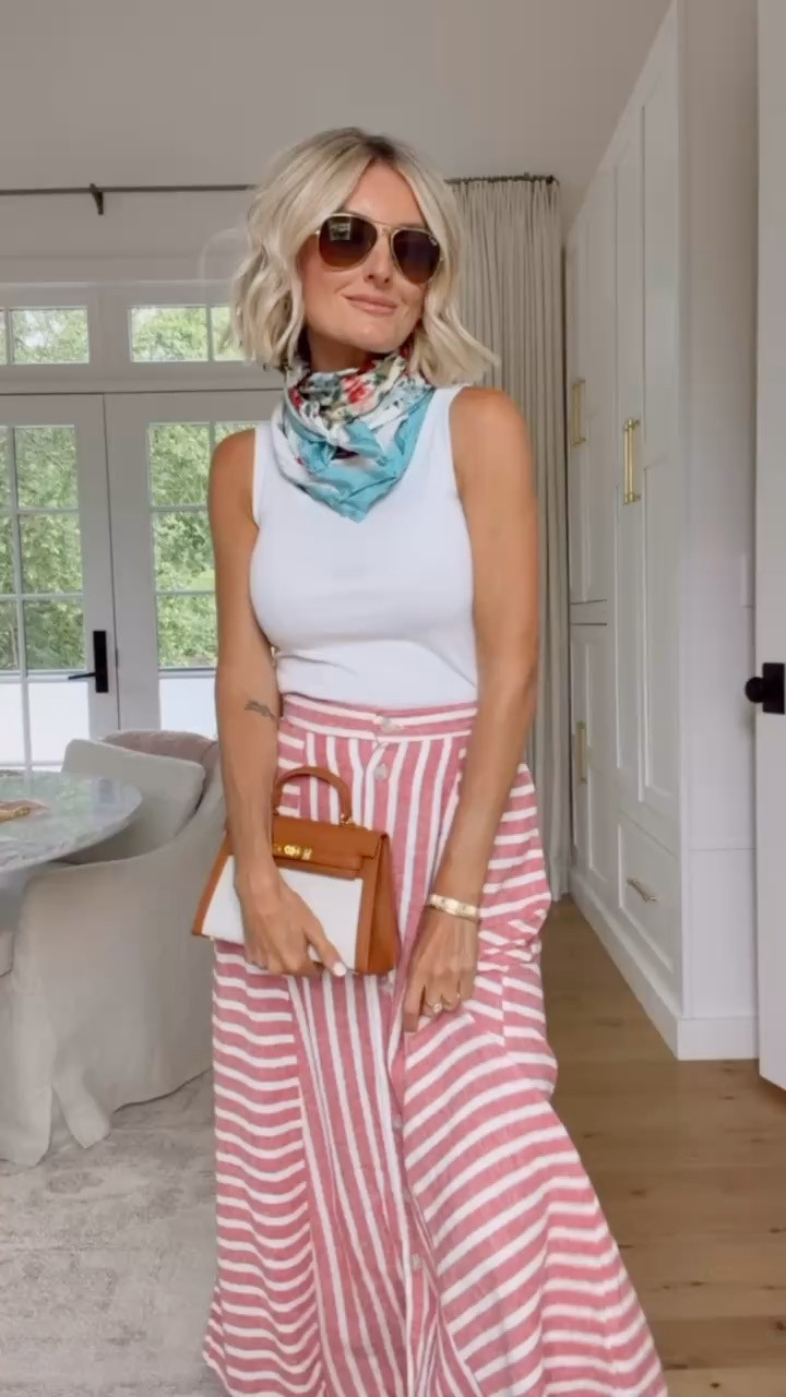 Love the asymmetrical stripes on this skirt! It is so affordable and looks like a high end brand! I paired it with a white tank and of course a patterned satin scarf! The skirt is also on sale now for under $20. Wearing S top and XS skirt Loverly grey, target circle days, red striped midi skirt, how to style white tank, affordable fashion finds for her 

 #LTKSeasonal #LTKSaleAlert