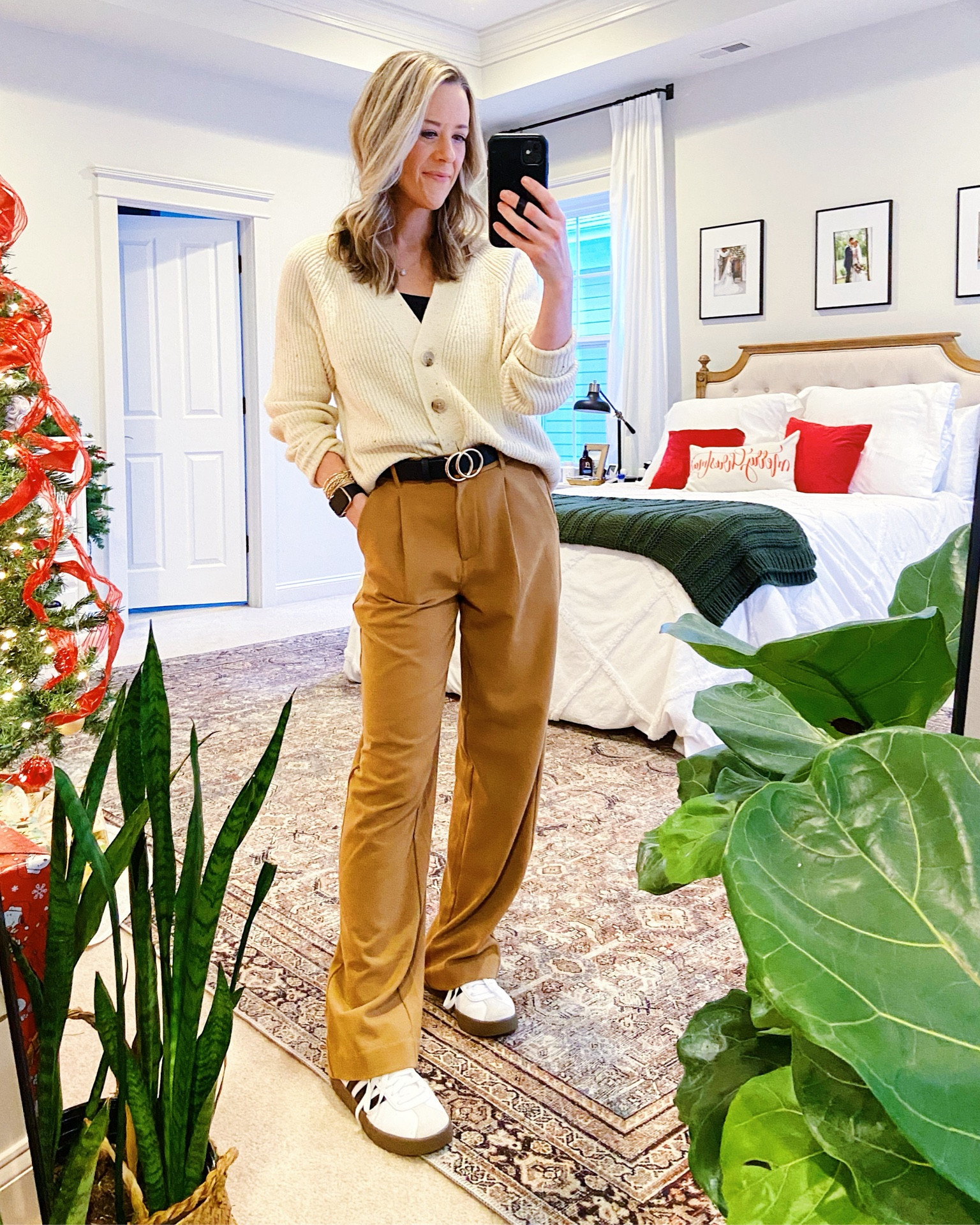 Casual trousers and sneakers outfit

Cream Cardigan: Old Navy Shaker Cardigan. Wearing a size XS. It’s a thick sweater and looks great tucked or untucked. It comes in several other colors as well. 
Trousers: Also an Old Navy Find (XS). These are a great option if the Abercrombie Sloan pants are more than you want to pay. The material is a little thinner but they’re so comfy. They feel like pjs. 
Belt: Amazon Find I wear on repeat. 
Shoes: Adidas Court. You can get these a ton of places but I got mine from Kohls. They run TTS. 

Elevated Mom Style | Nursing Friendly | Pumping Friendly Workwear | Casual Workwear | Brunch Outfit | Affordable Winter Style | Sambas outfit | Camel Trousers  

#LTKworkwear #LTKfindsunder50 #LTKstyletip