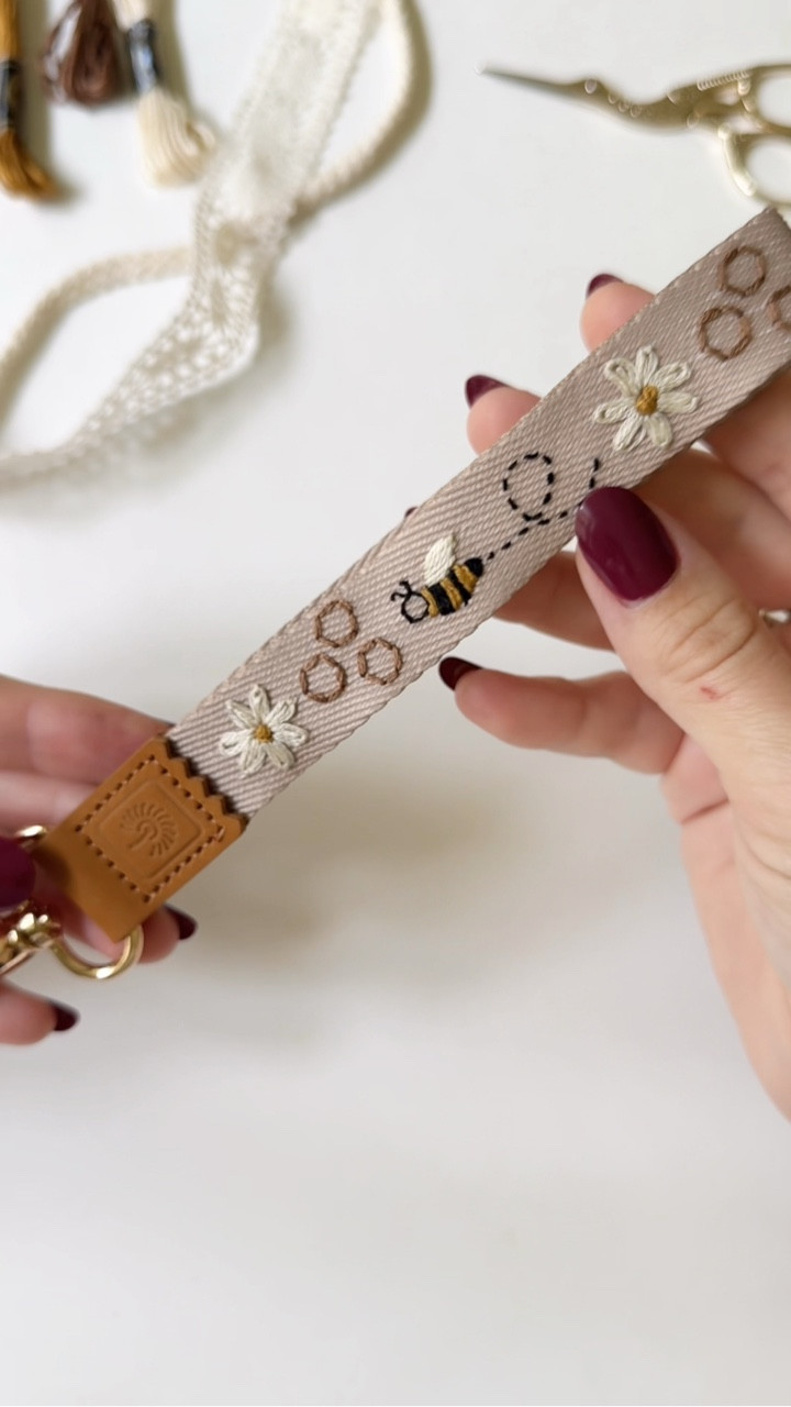 Wish I could say I was up cycling something I already had, but the truth is I bought this keychain just so I could embroider it 💁🏻‍♀️🫣

The bee pattern is part of my stick and stitch embroidery pack called DAINTY STRIPS. Comment “bees” for the link and I’ll also link the keychain I used