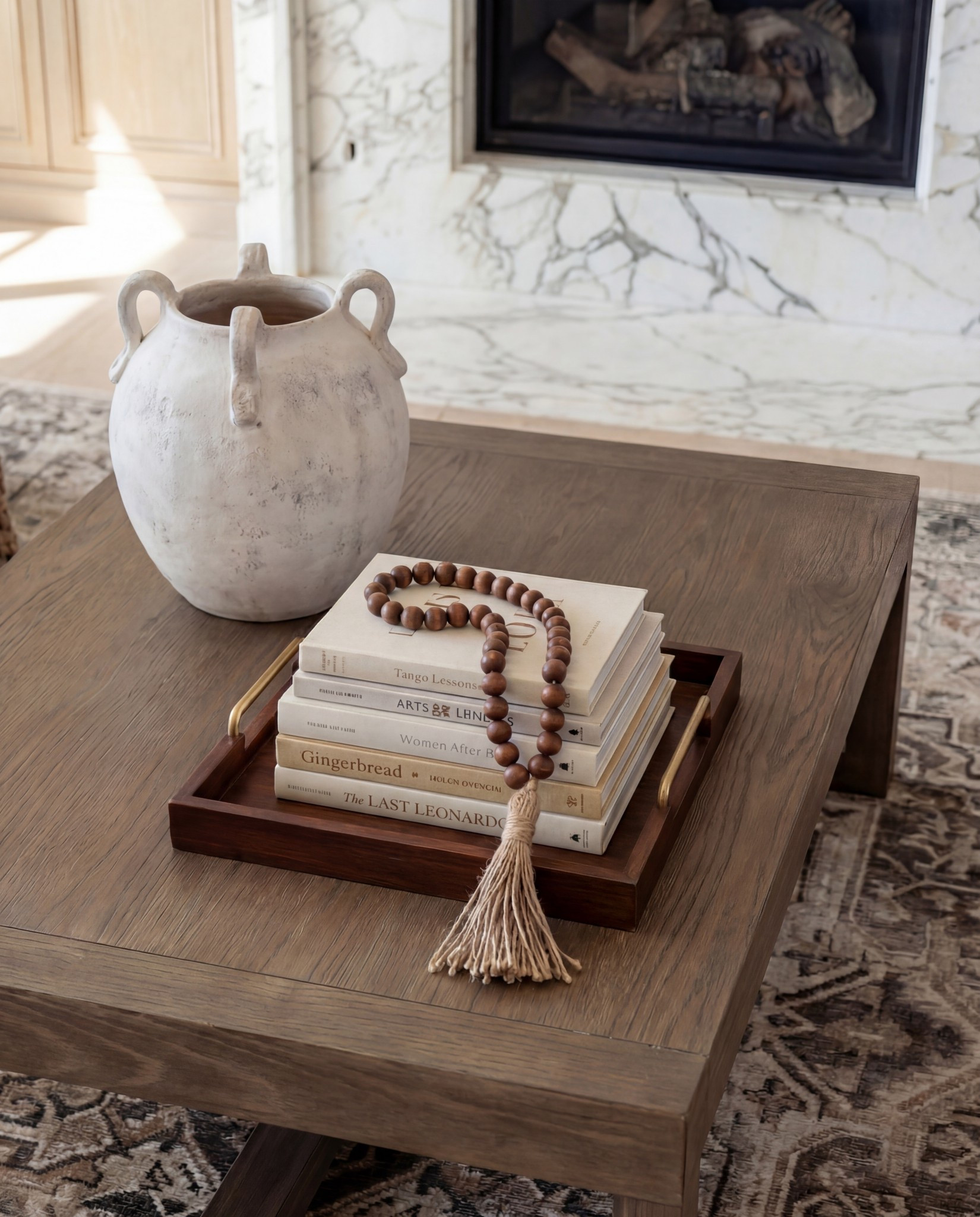 Shop the Look:
• Cream upholstered sofa
• Oak wood accent chairs (curved arms)
• Marble-look fireplace décor
• Solid wood coffee table
• Neutral vintage-style area rug
• Ceramic vase + beads styling set
• Light oak built-ins (or styling pieces for shelves)
• Tan patterned throw pillows
• Soft woven throw blanket
Wood Decor beads

#LTKHome #LTKFindsUnder100 #LTKSaleAlert