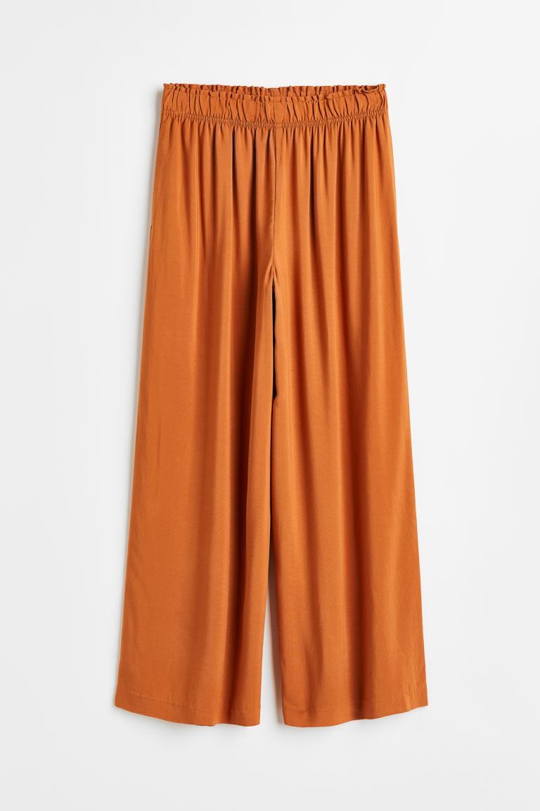 Conscious choice  New ArrivalAnkle-length pants in softly draped, woven viscose fabric. High wais... | H&M (US + CA)