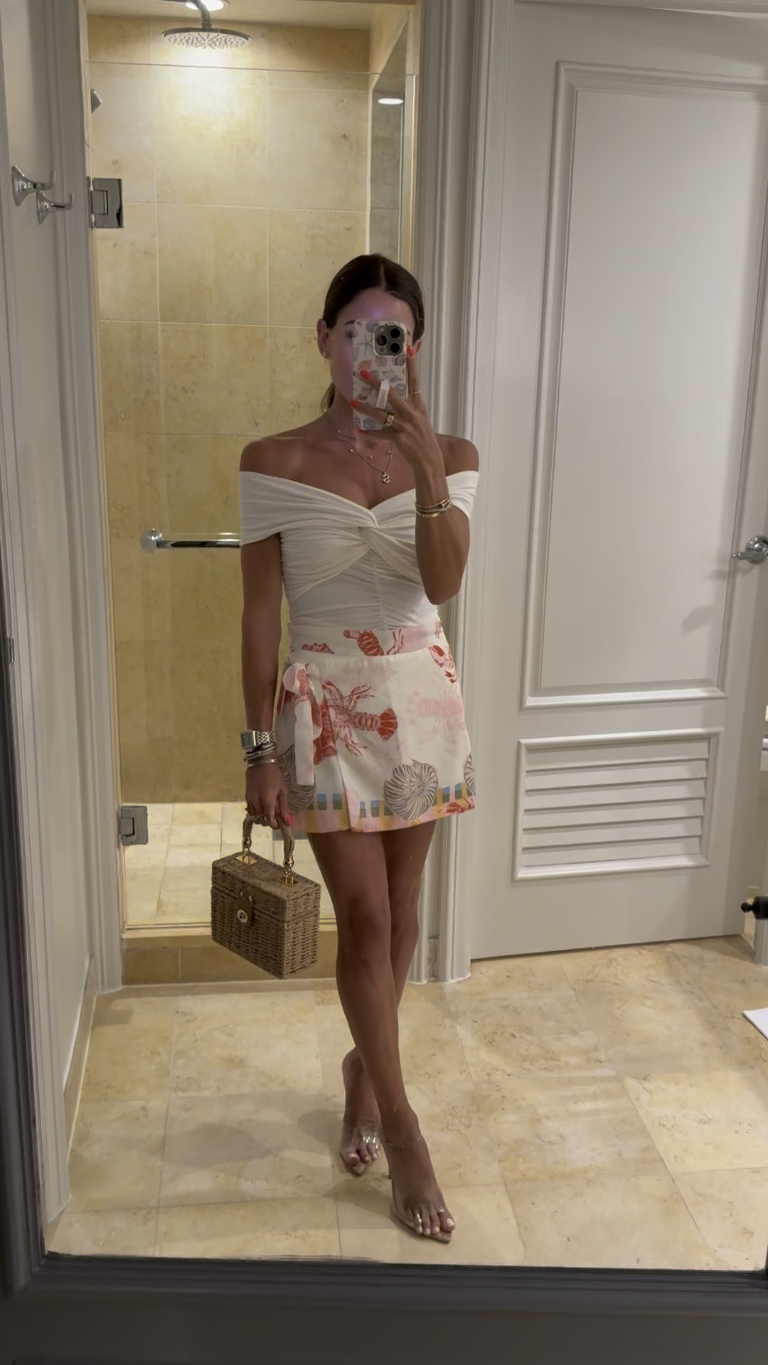 Off shoulder ruched top vacation shell printed skirt with shorts under rattan bag fir summer vacation clear Amazon heels that look luxe

#LTKPetite #LTKootd