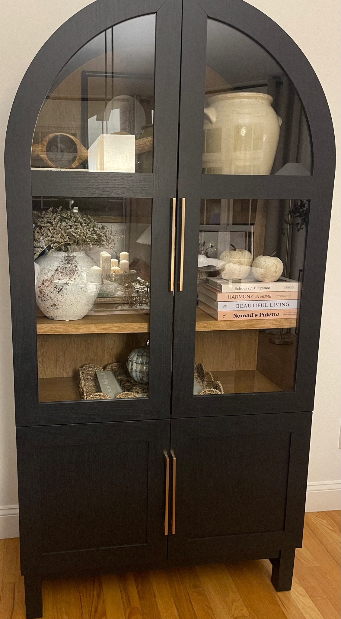 My arc cabinet from Walmart is back in stock in the honey color! This is an affordable option to the ones from high end stores!
I changed the handles for ones from Amazon.

#LTKStyleTip #LTKHome