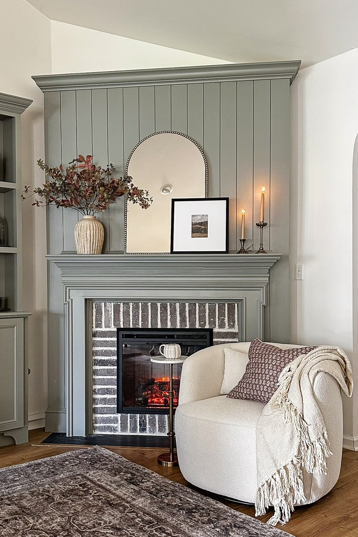 Cozy, fall fireplace nook with finds from @homedepot! The Home Depot’s Labor Day savings event is going on now with up to 30% off furniture, decor, and more. Including this swivel barrel chair, marble and brass accent table, classic beaded arch mirror, cozy throw blanket, and square matte gallery wall picture frame set.

#thehomedepotpartner #thehomedepot 

#LTKStyleTip #LTKSaleAlert #LTKHome