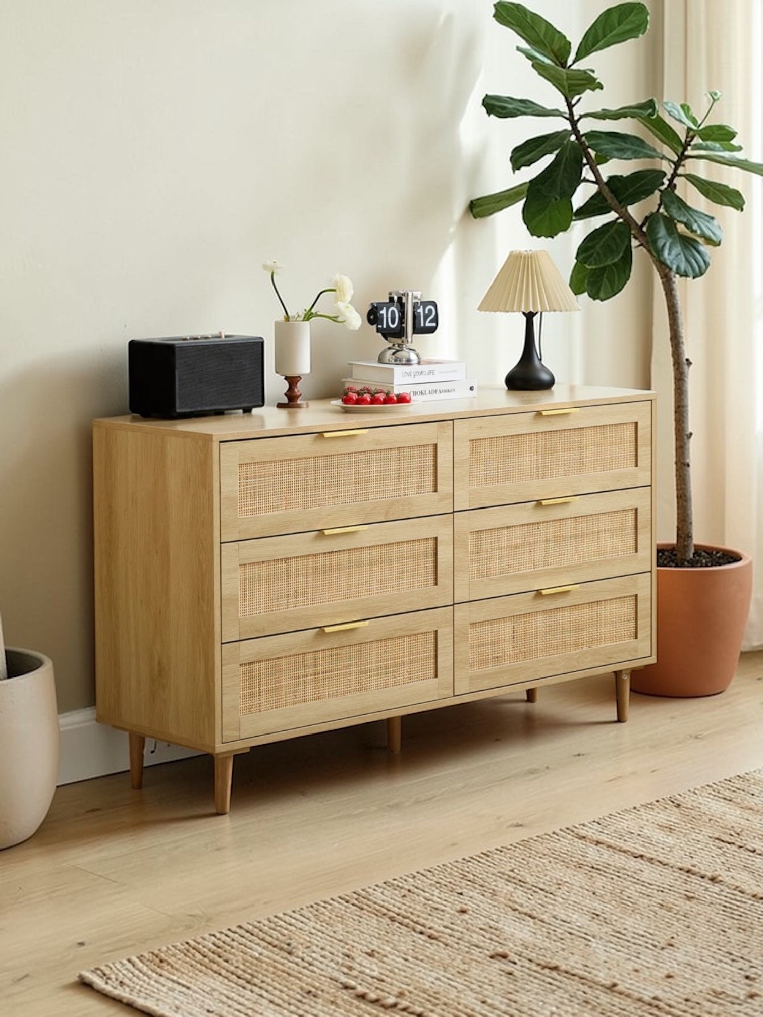 Elevate your home décor with our 51-inch rattan dresser, featuring handwoven natural rattan details and elegant gold handles. With six spacious drawers, this dresser provides ample storage for clothes, linens, and more, ensuring a clutter-free home. Its versatile design allows it to double as a TV stand, making it perfect for the bedroom, living room, or entryway.

#LTKU #LTKHome #LTKSaleAlert