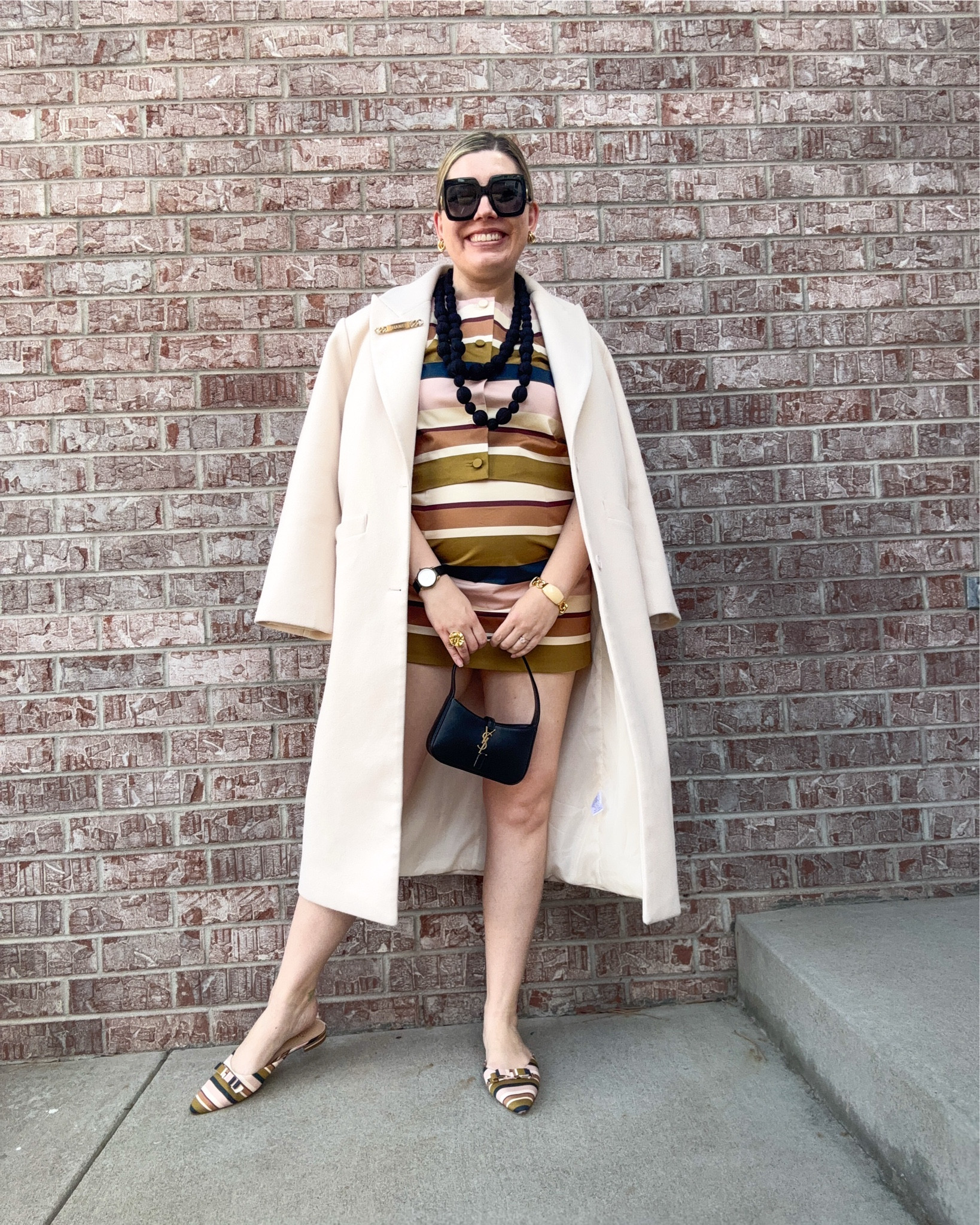 Off the Wall(paper) - Look 4
A curated style series

I meant to return this set because while I ADORE the fit of the top, the skirt ran too small for me and they were sold as a set. Then I missed the return window and so now I am rocking a micro mini in the middle of winter. Thanks executive functioning issues. 🙄 😂 
Cute though, right?

Off The Wall(paper) is a celebration of one of my favorite styling hacks: MATCH EVERYTHING. I get outsized amounts of joy from a couple of funny things: 1. Lining things up (yes, literally) and 2. Finding things that match and then LINING THEM UP. This is that desire embodied in a capsule series. 

Top & skirt set - Dillards @dillards 
Necklace - Dillards 
Shoes - Dillards
Bag - YSL
Coat - Lioness
Sunglasses - Gucci
Ring - Rocksbox
Bracelet - Vintage J. crew
Earrings - House of Harlow
Watch - Tory Burch
Brooch - Chanel

#LTKsalealert #LTKstyletip #LTKSeasonal