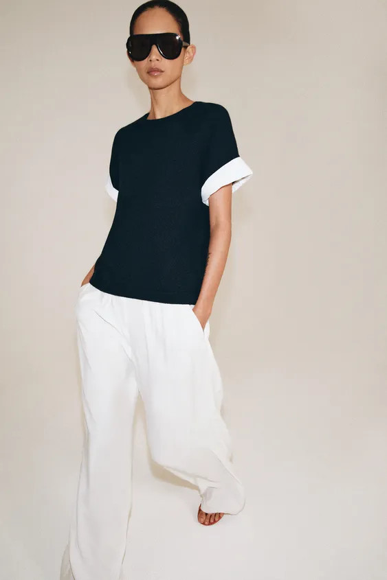 Model height: 178 cmRound neck jumper with short sleeves featuring a turn-up detail and contrast ... | Zara UK