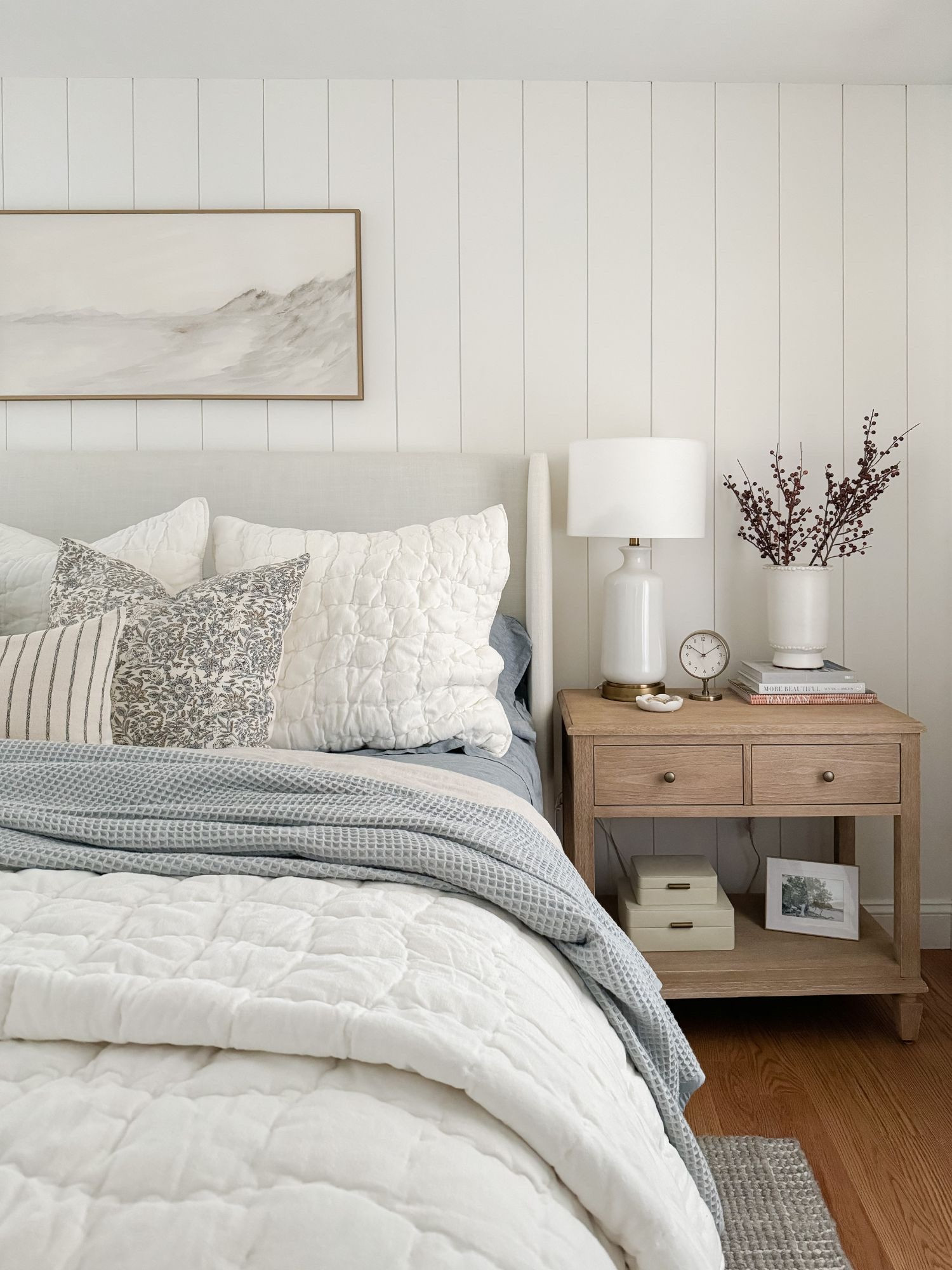 A soft coastal winter bedroom nightstand layered with clean ceramics, stacked books, and simple berry branches. This bedside setup adds just enough winter interest while keeping things calm and refined. Winter bedroom, coastal nightstand styling, neutral bedside decor, coastal winter bedroom, ceramic lamp, winter nightstand decor, minimal bedroom styling, serene coastal bedroom, layered nightstand, soft winter accents, Sherri Calnan Home

#LTKSeasonal #LTKHome