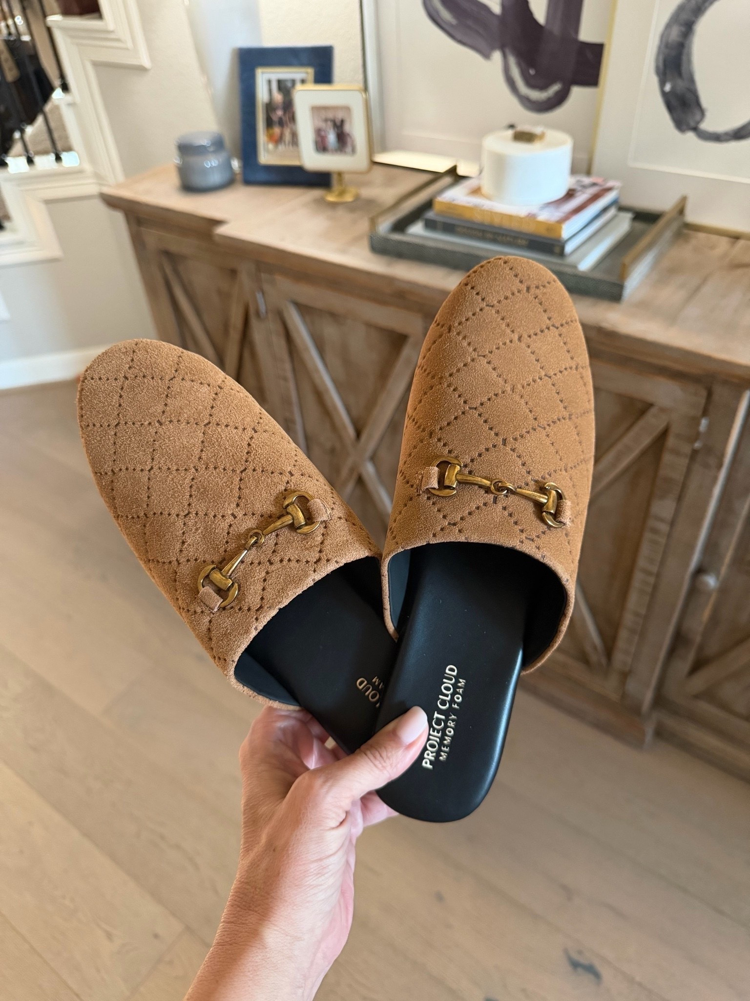 These camel suede mules are such a pretty shoe for fall! I love the quilted stitching and gold horsebit detail, which give them a designer inspired look without sacrificing comfort. The slip on style makes them easy to pair with straight leg jeans, trousers, or a casual sweater outfit, and the warm brown color goes with so much this season.
Project Cloud mules, suede mules, camel brown mules, quilted mules, horsebit mules, gold buckle shoes, designer inspired shoes, slip on loafers, fall shoes for women, casual fall footwear, women over 40 fashion, fall outfit ideas, HauteandHumid