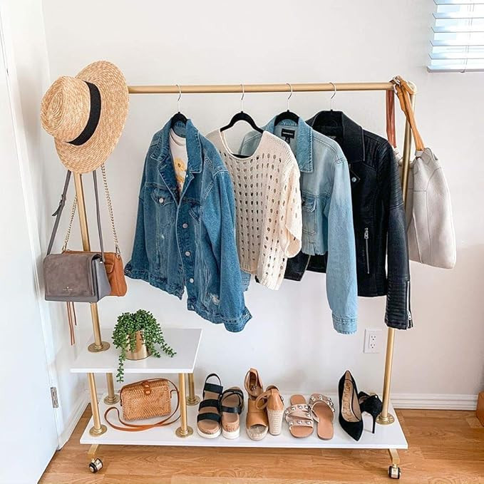 HOMEKAYT Metal Pipe Hanging Rack Gold Clothing Rack with Shelf Industrial Garment Rack Boutique R... | Amazon (US)