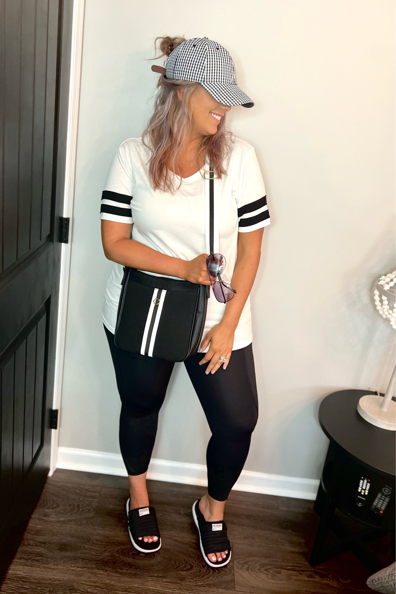 ✨SIZING•PRODUCT INFO✨
⏺ V-neck White Tee with Black Varsity Stripes - TTS - Large (great with leggings!) - Amazon 
⏺ Black Leggings - linking similar Walmart version (I wear an XL - TTS) 
⏺ Black Nike Slides - I sized up one 
⏺ Black and White Striped Crossbody Bag - Walmart 
⏺ Black Aviator Sunglasses - Walmart 
⏺ Black and White Gingham Hat - Linked Similar 

📍Say hi on YouTube•Tiktok•Instagram ✨Jen the Realfluencer✨ for all things midsize-curvy fashion!

👋🏼 Thanks for stopping by, I’m excited we get to shop together!

🛍 🛒 HAPPY SHOPPING! 🤩

#amazon #amazonfind #amazonfinds #founditonamazon #amazonstyle #amazonfashion #walmart #walmartfinds #walmartfind #walmartfall #founditatwalmart #walmart style #walmartfashion #walmartoutfit #walmartlook  #leggings #style #inspo #fashion #leggingslook #leggingsoutfit #leggingstyle #leggingsoutfitidea #leggingsfashion #leggingsinspo #leggingsoutfitinspo #athletic #althleticwear #athleticoutfit #athleticstyle #athleticlook #athleticfashion #athleisure #athleisurewear #athleisureoutfit #athleisurelook #athleisurestyle #athleisurefashion #sport #sportyoutfit #sportoutfit #sportylook #sportlook #sportstyle #sportystyle #sportyfashion  #under100 #affordable #budget #inexpensive #budgetfashion #affordablefashion #budgetstyle #affordablestyle #curvy #midsize #size14 #size16 #size12 #curve #curves #withcurves #medium #large #extralarge #xl   

#LTKunder50 #LTKcurves #LTKstyletip